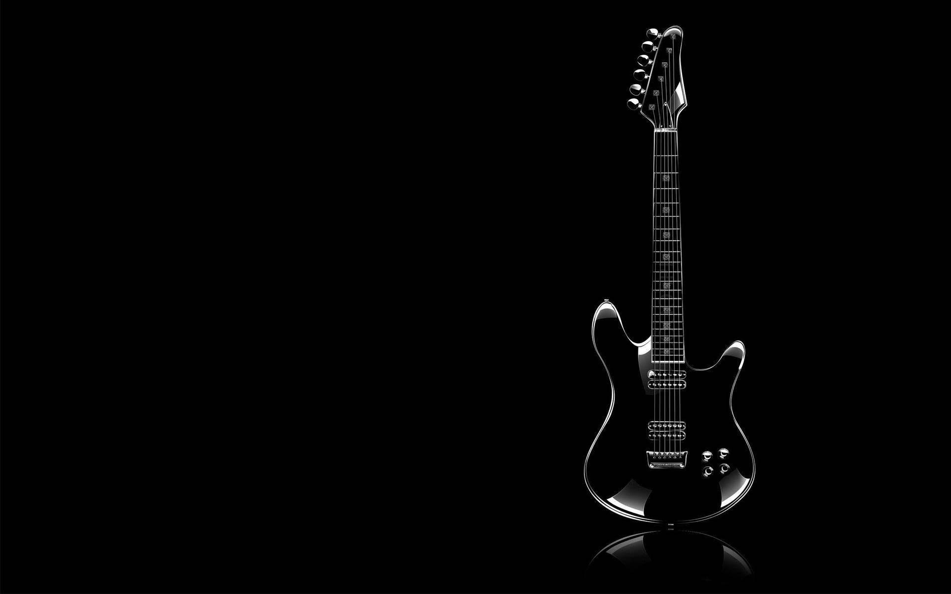 Black Guitar Against Dark Screen Background