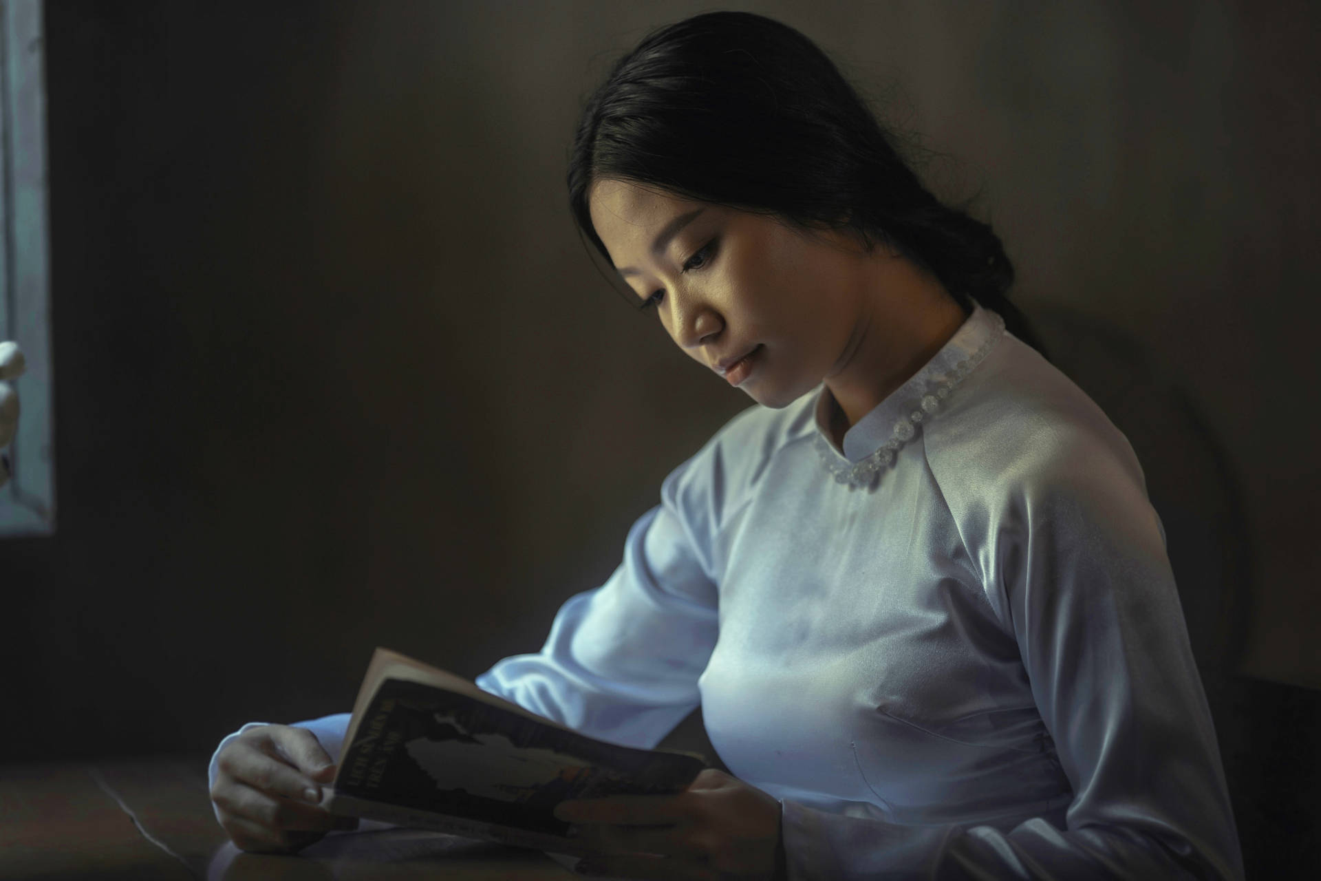 Black-haired Woman Reading Book Background