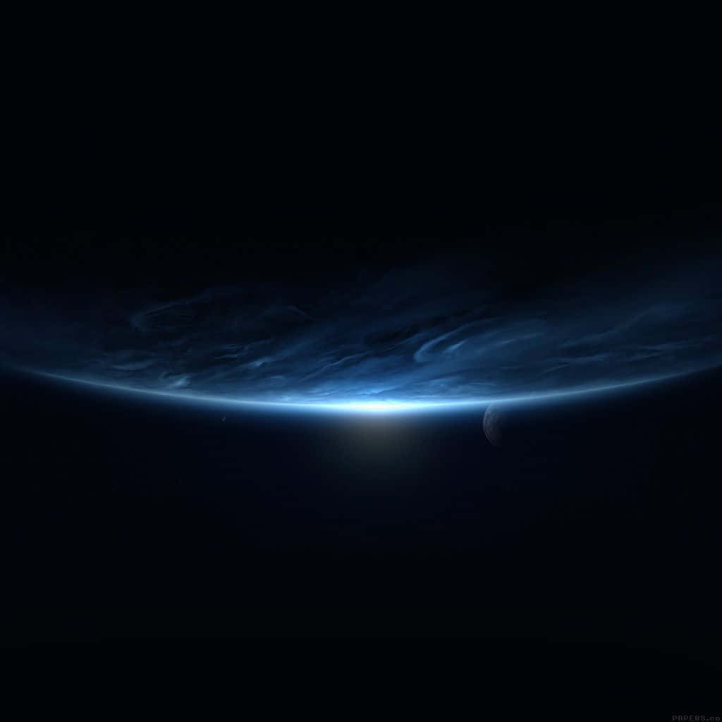 Black Ipad With Blue Planet In Outer Space Background