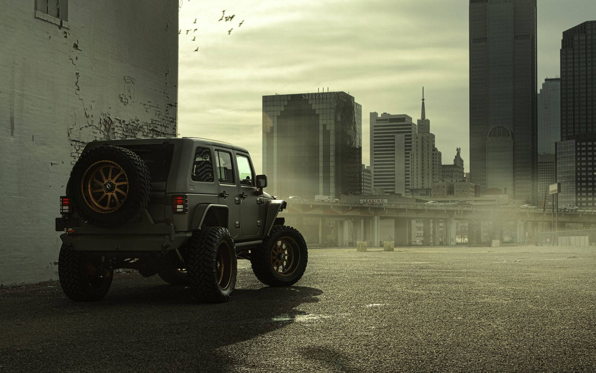 Black Jeep Wrangler Parked In City Background