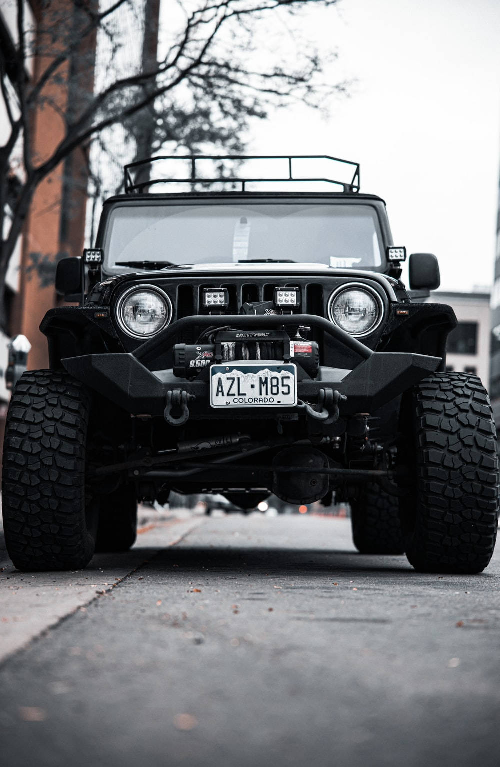Black Jeep Wrangler With Huge Tires Background