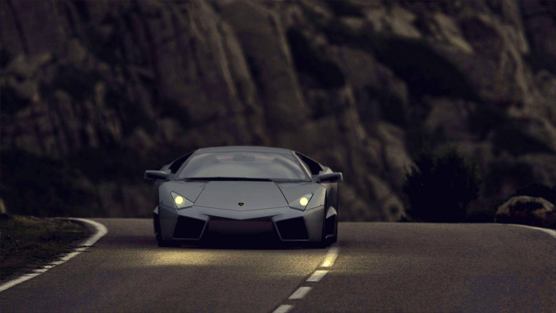 Black Lamborghini On The Road Background