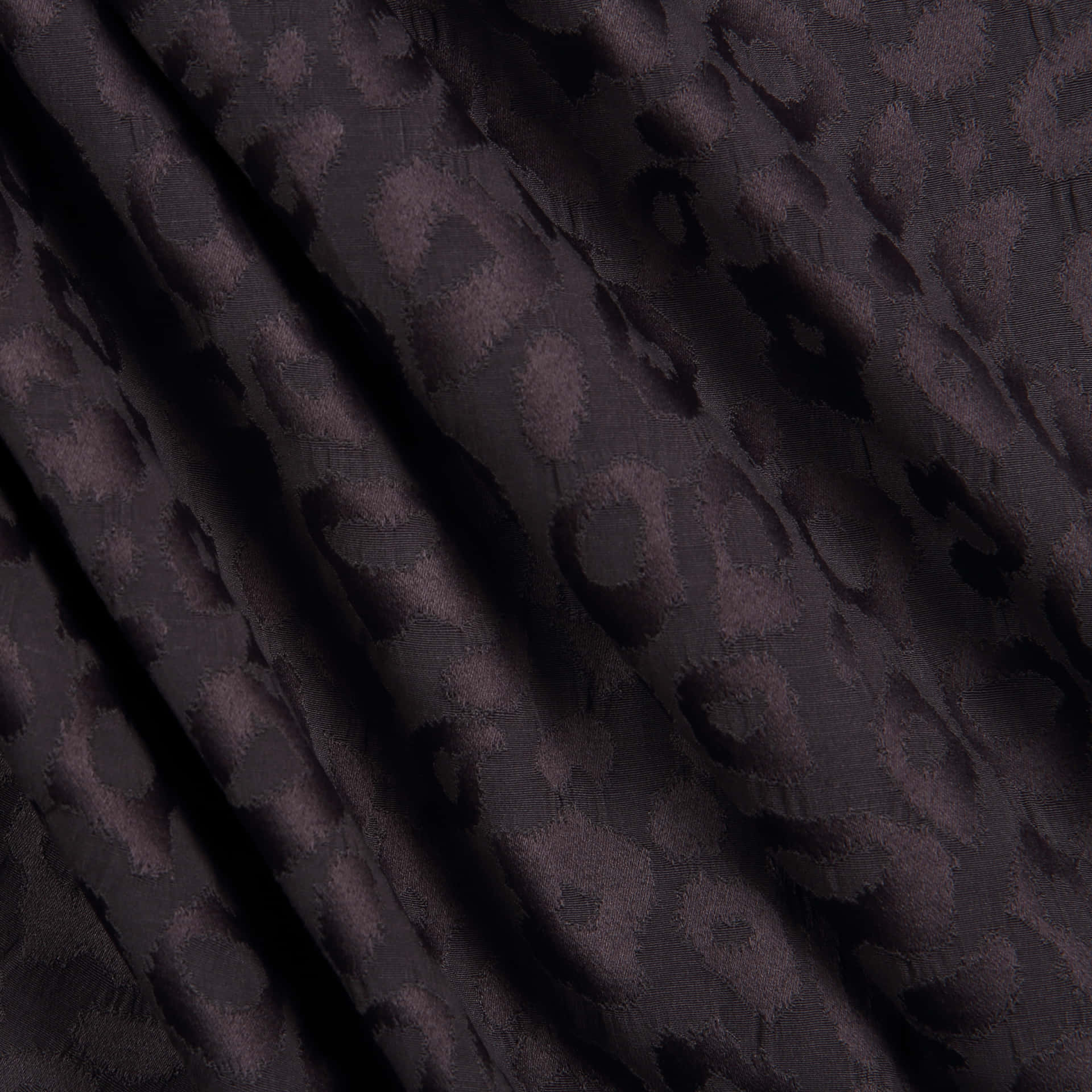Black Leopard Print Fabric Texture Background