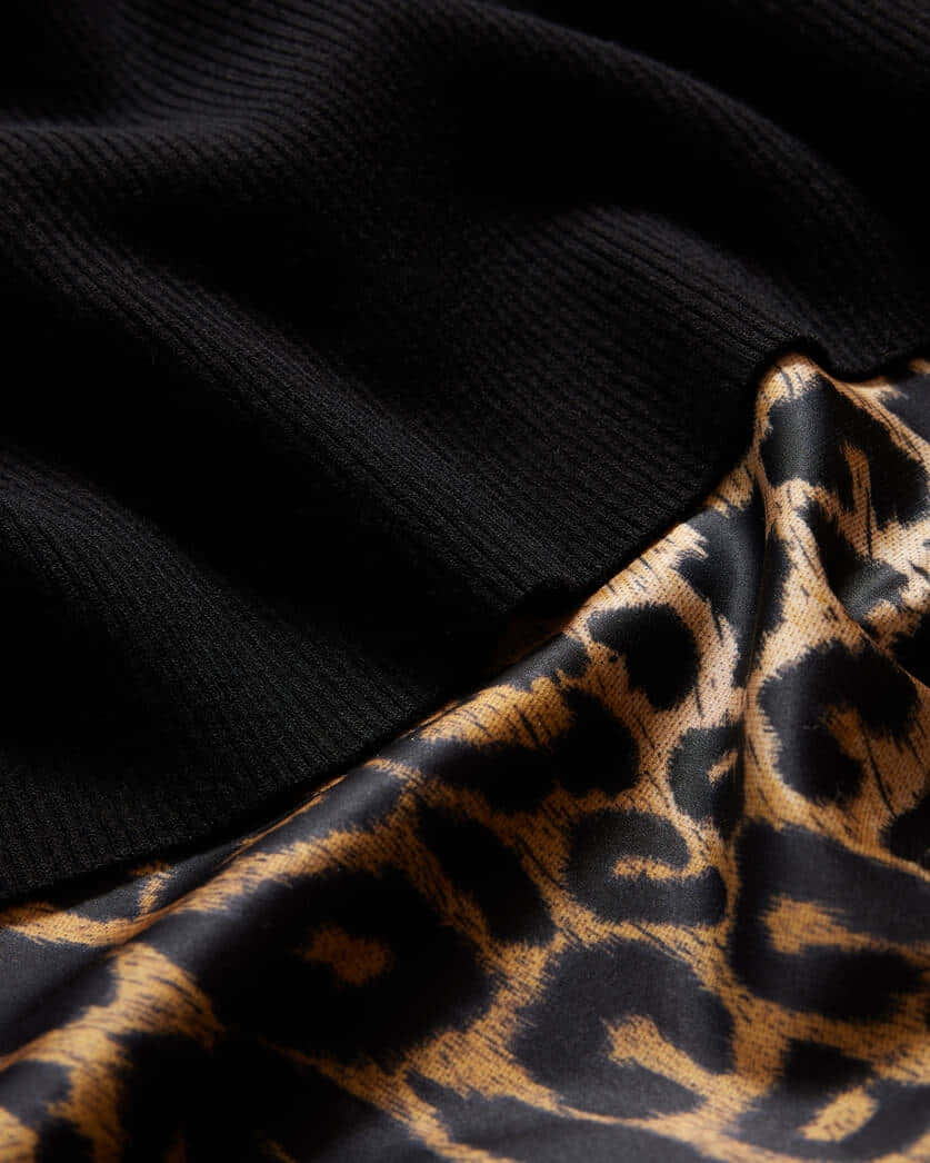 Black Leopard Print Fabric Texture Background