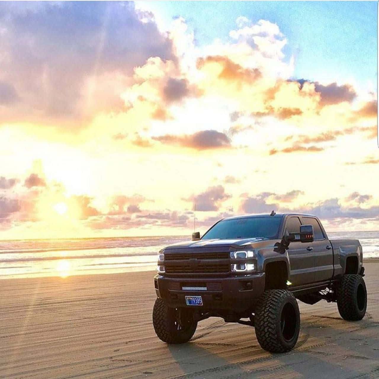 Black Lifted Truck On The Beach Background