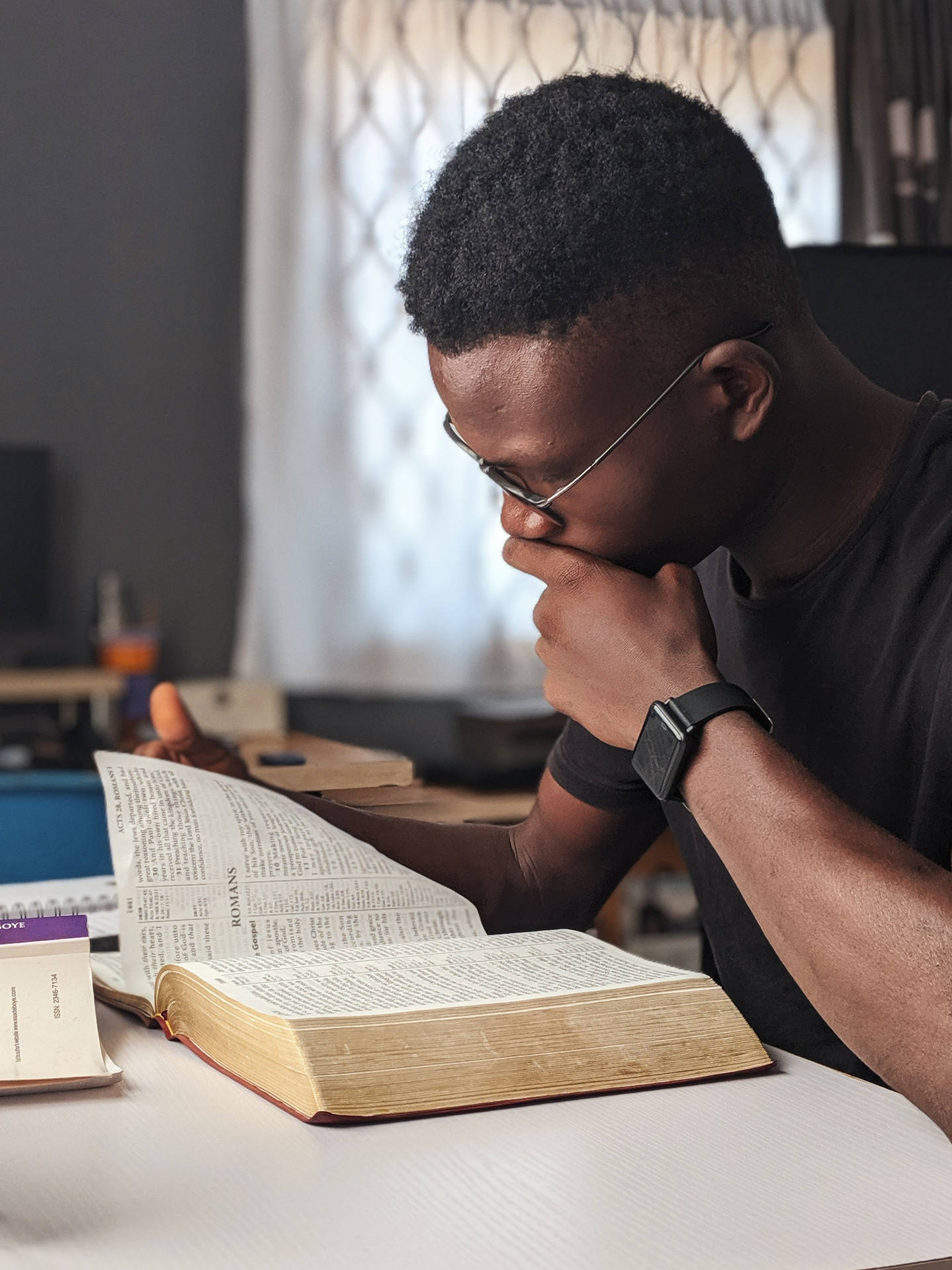 Black Man Focus On His Book Background