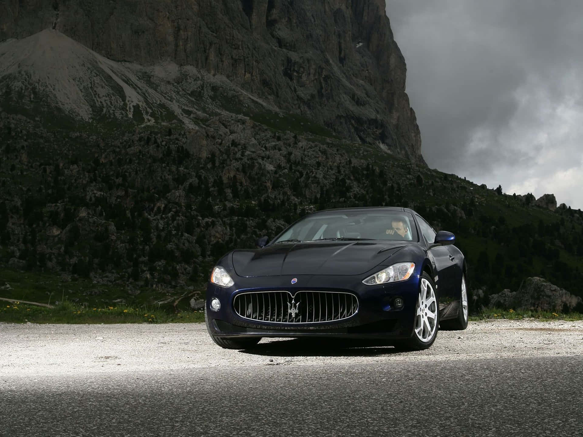 Black Maserati On A Cliff 4k Background