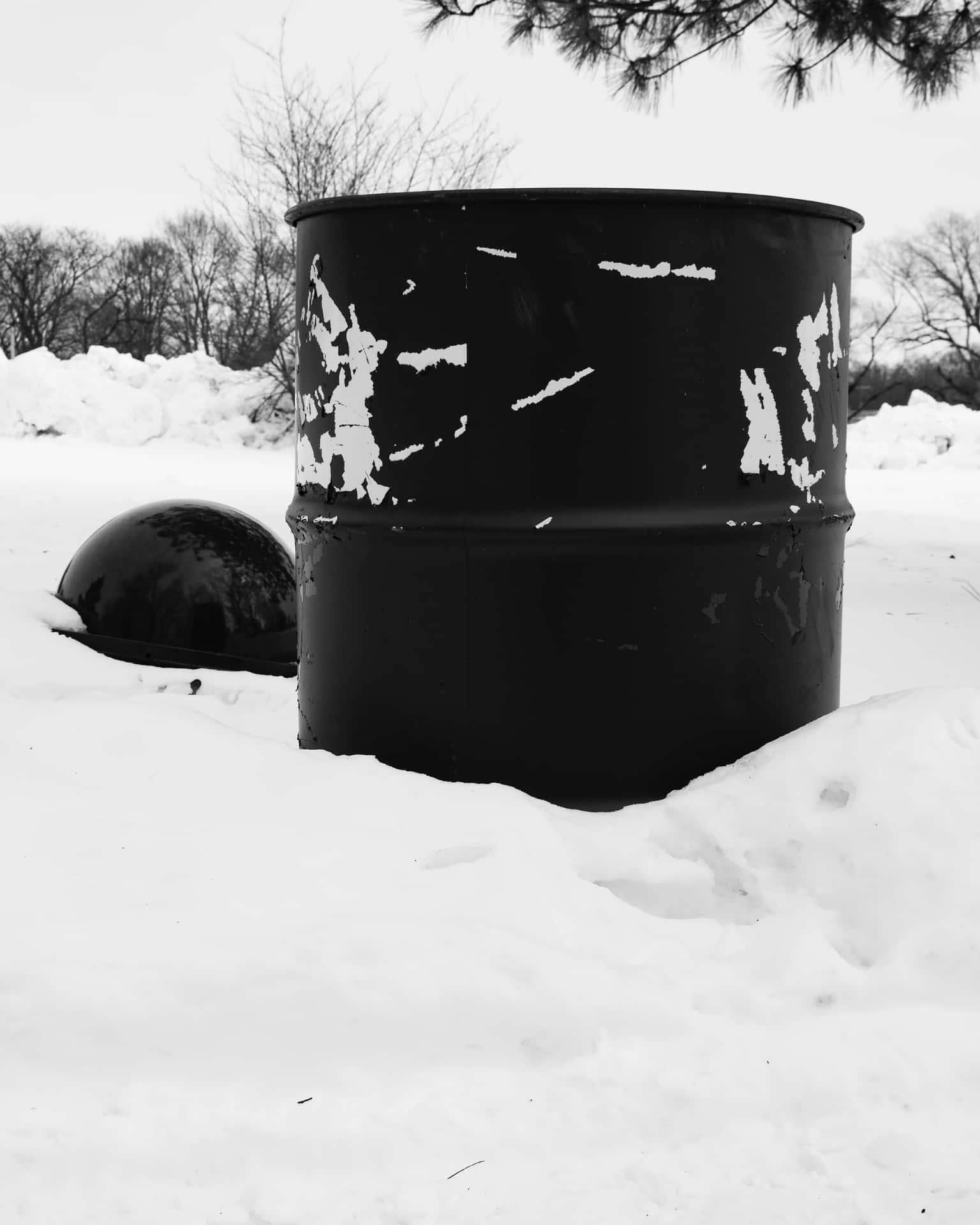 Black Metal Trash Can In Snow Background