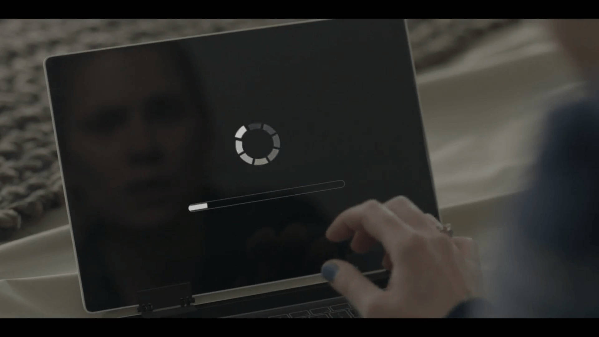 Black Mirror Laptop Displaying Loading Icon