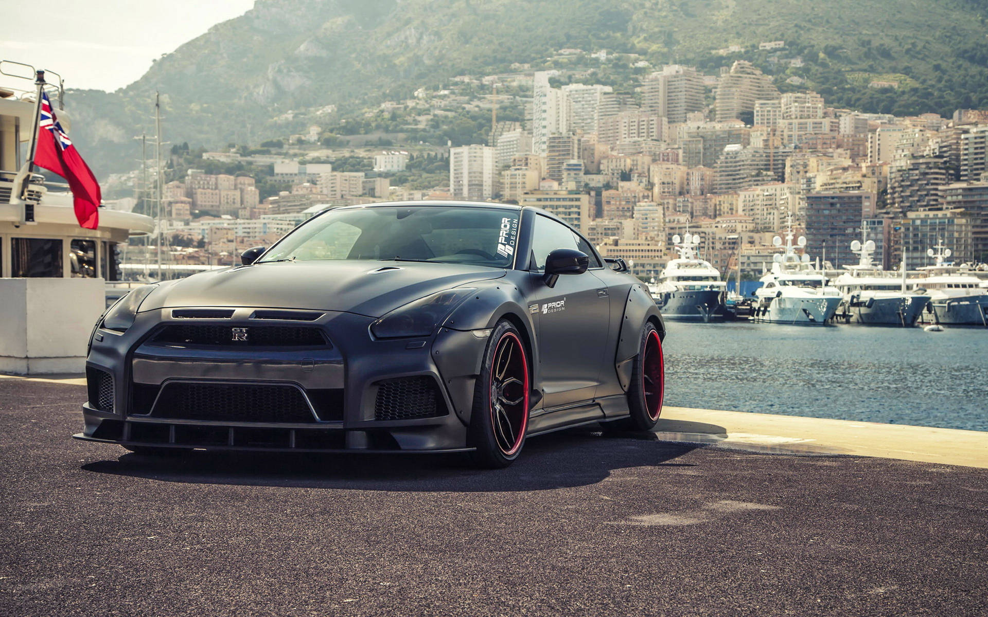 Black Nissan Gtr Car In Front Of Ocean Background