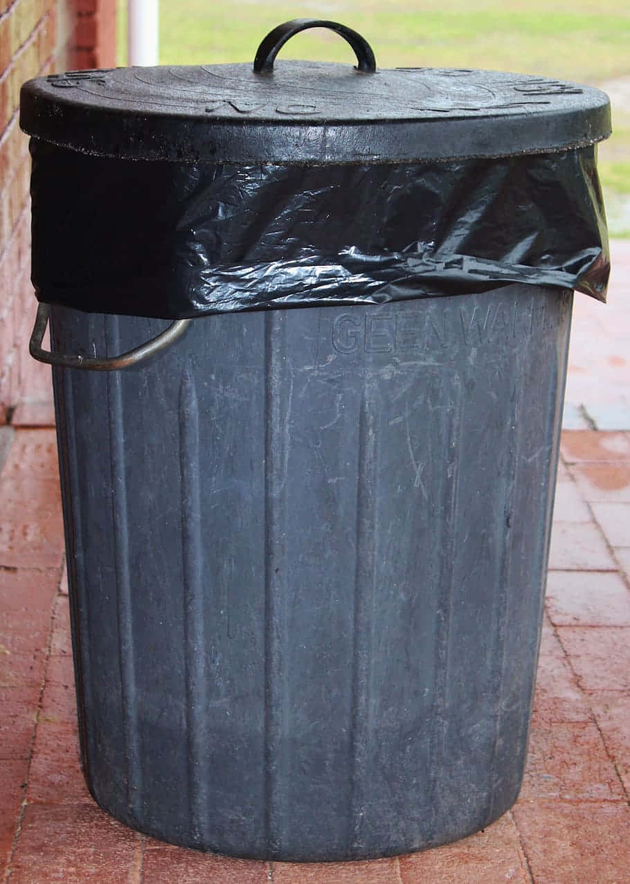 Black Plastic Barrel Trash Can With Lid Background