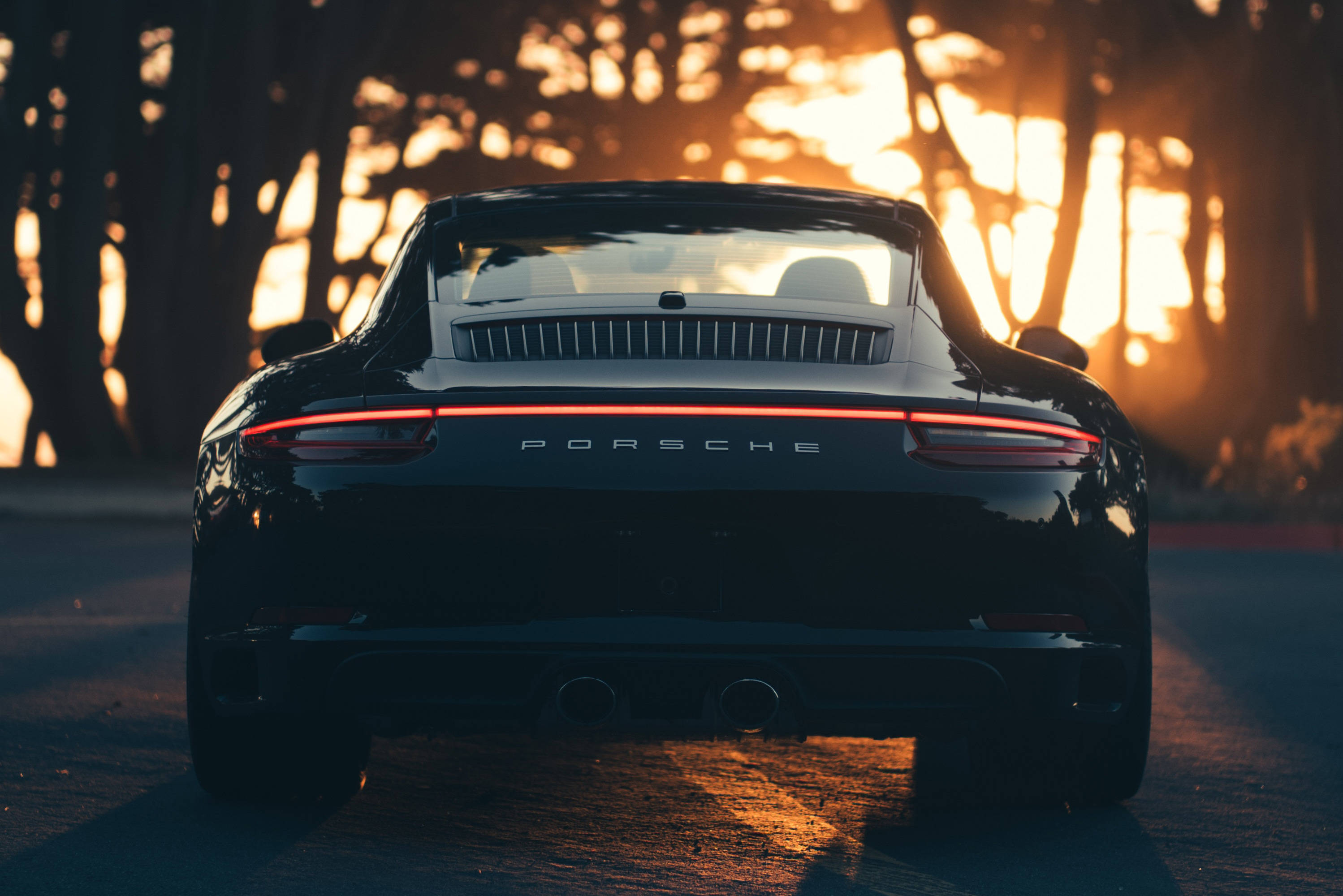 Black Porsche 911 Watching The Sunset Background