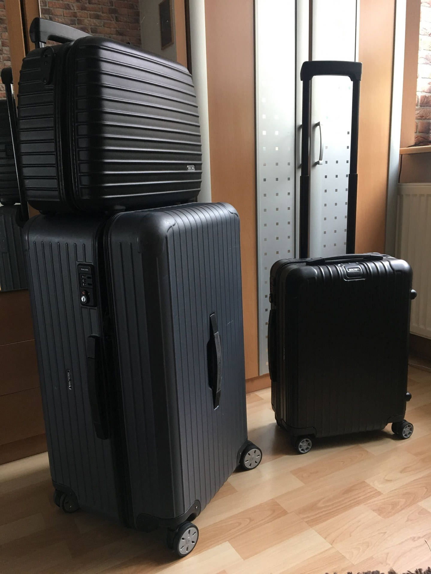 Black Rimowa Suitcases In Different Sizes