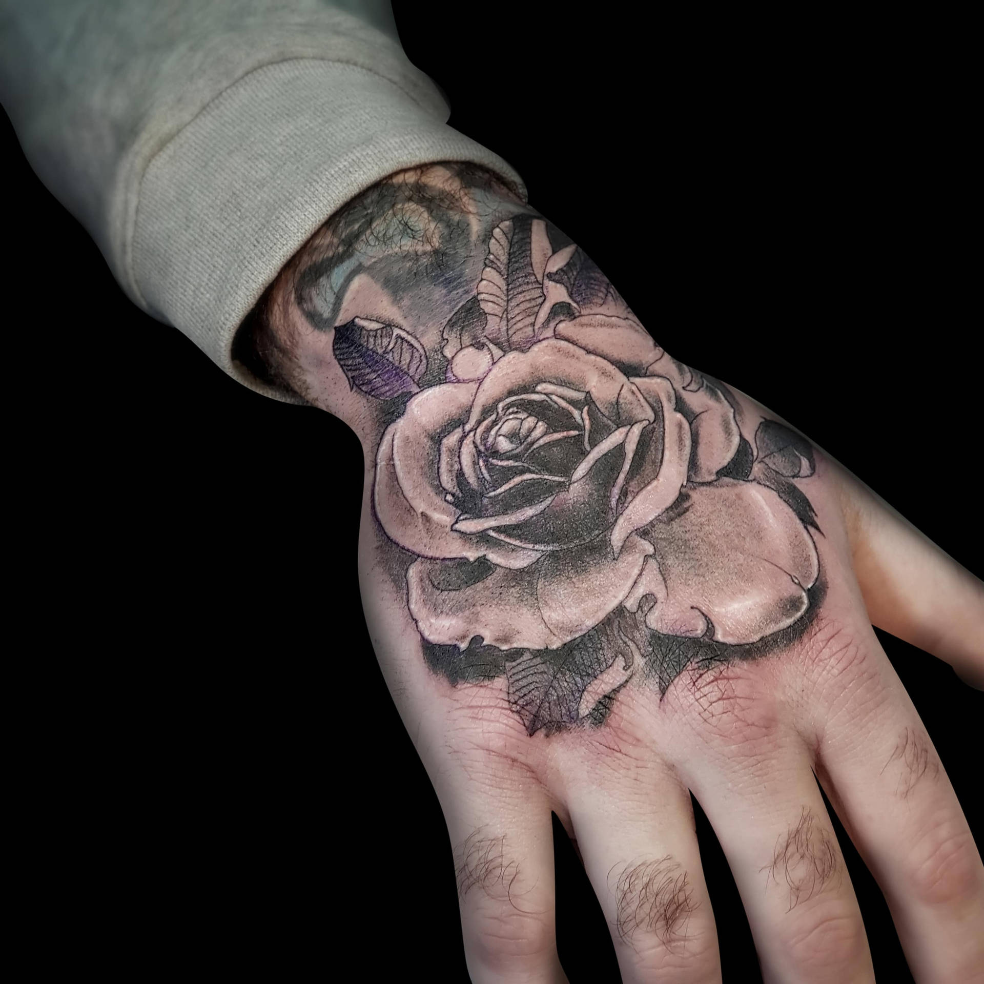 Black Rose Tattoo On Hand Background
