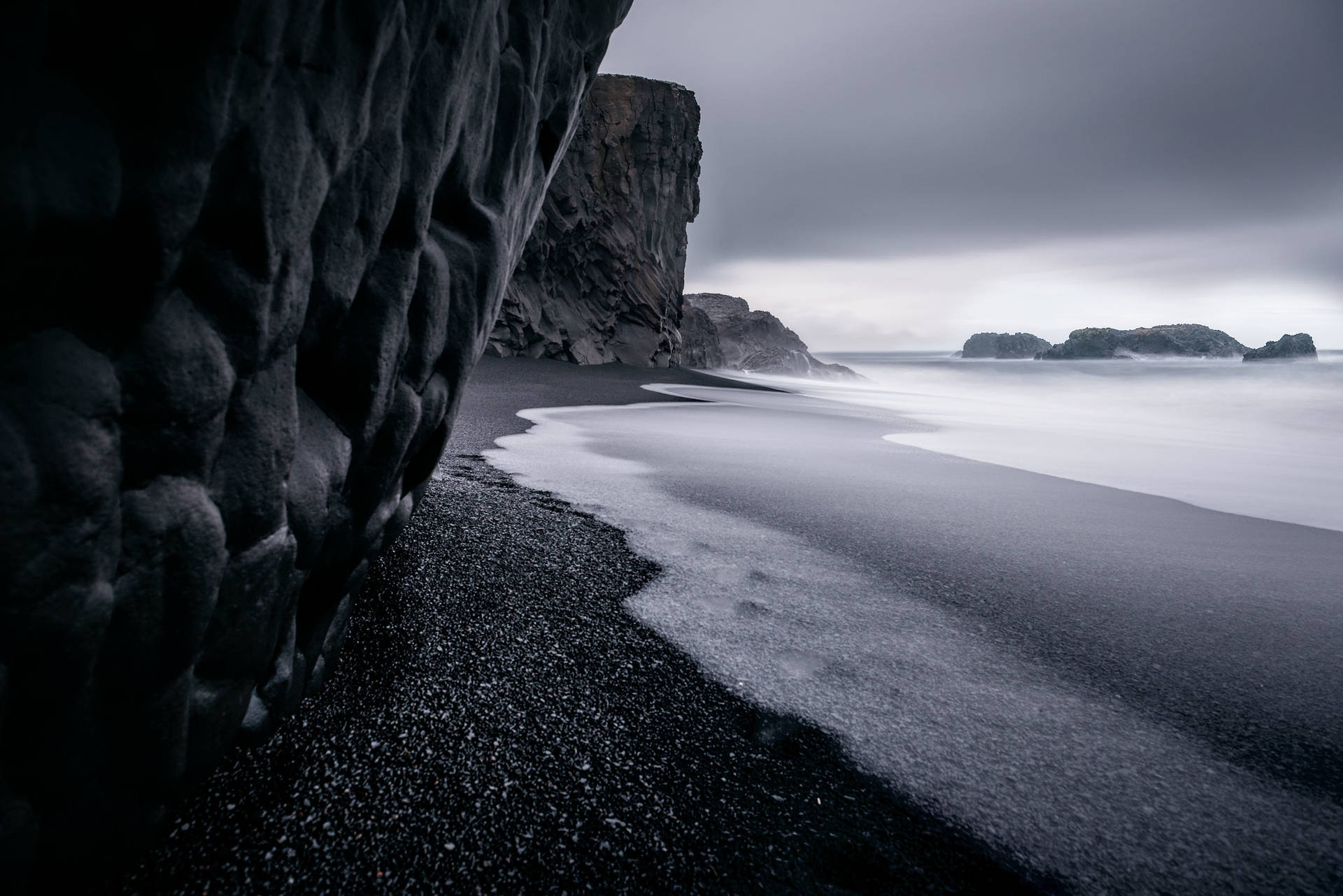 Black Sand And Sea Background Background