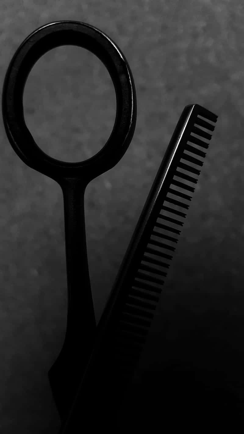 Black Scissor With Comb Used For Cutting Background
