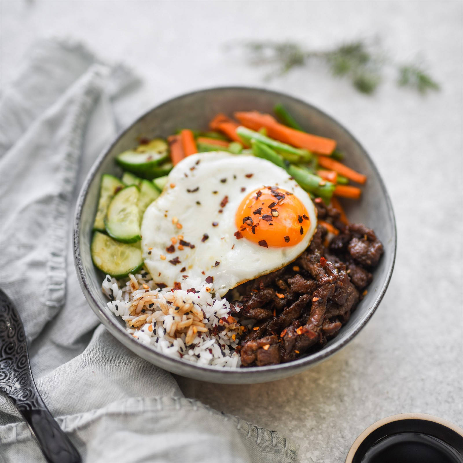 Black Sesame Seeds Over Bibimbap Background