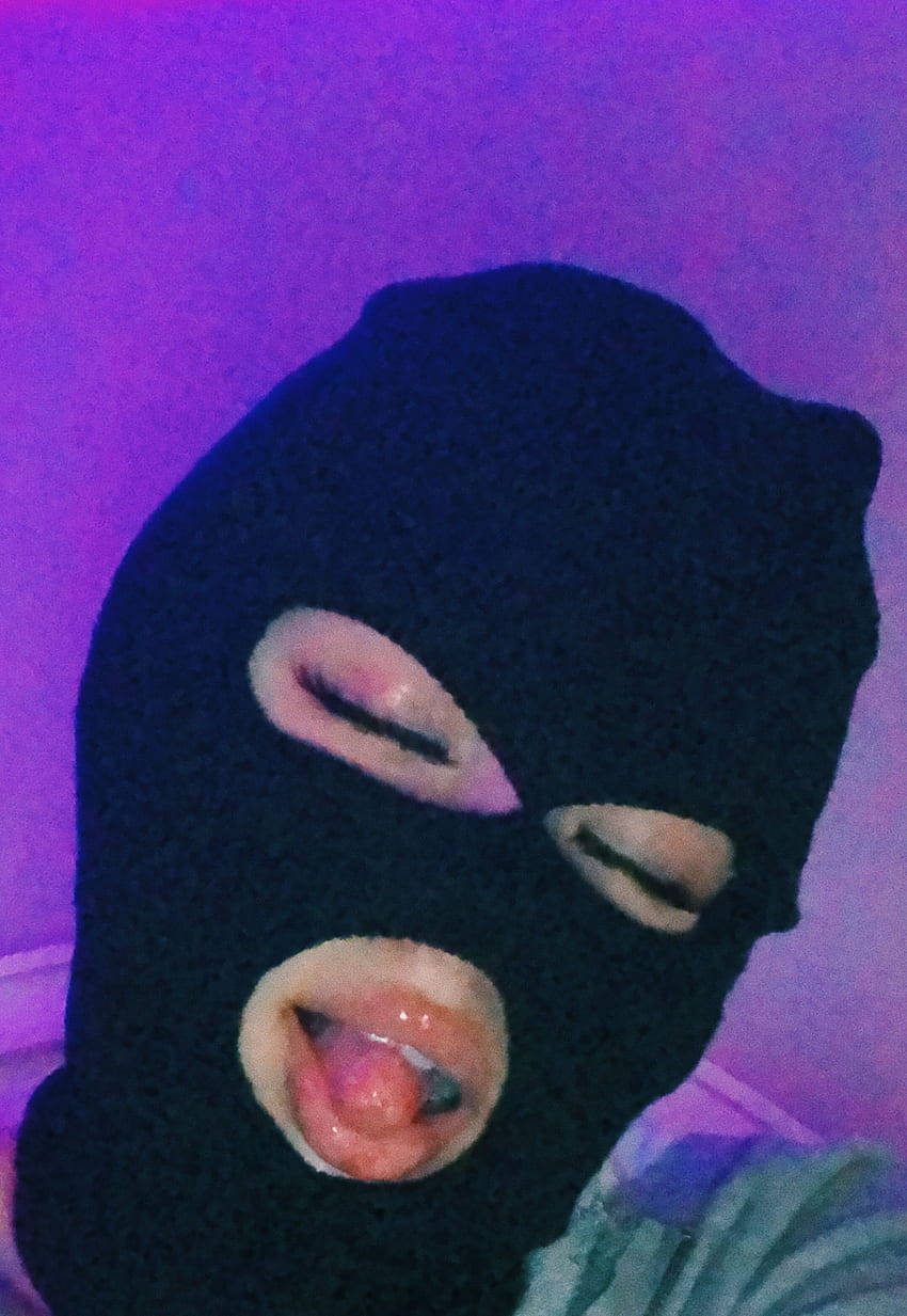 Black Ski Mask Sticking Tongue Out Background