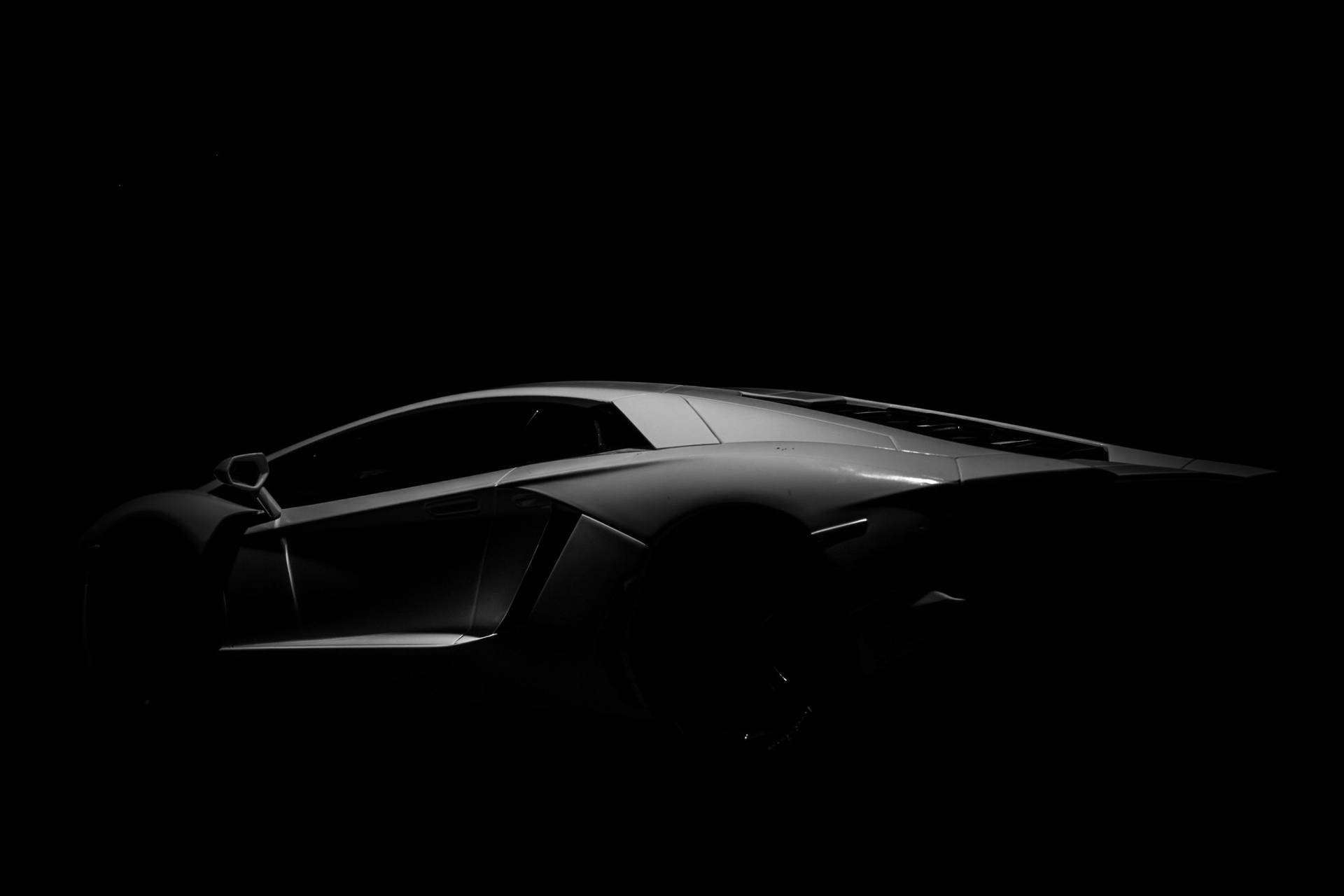 Black Sports Cars In The Dark Background