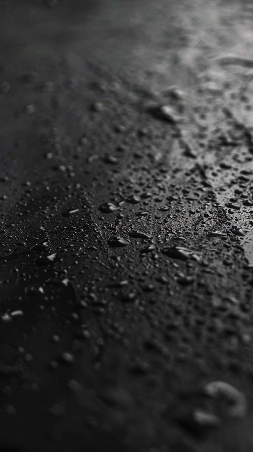 Black_ Surface_with_ Water_ Droplets Background