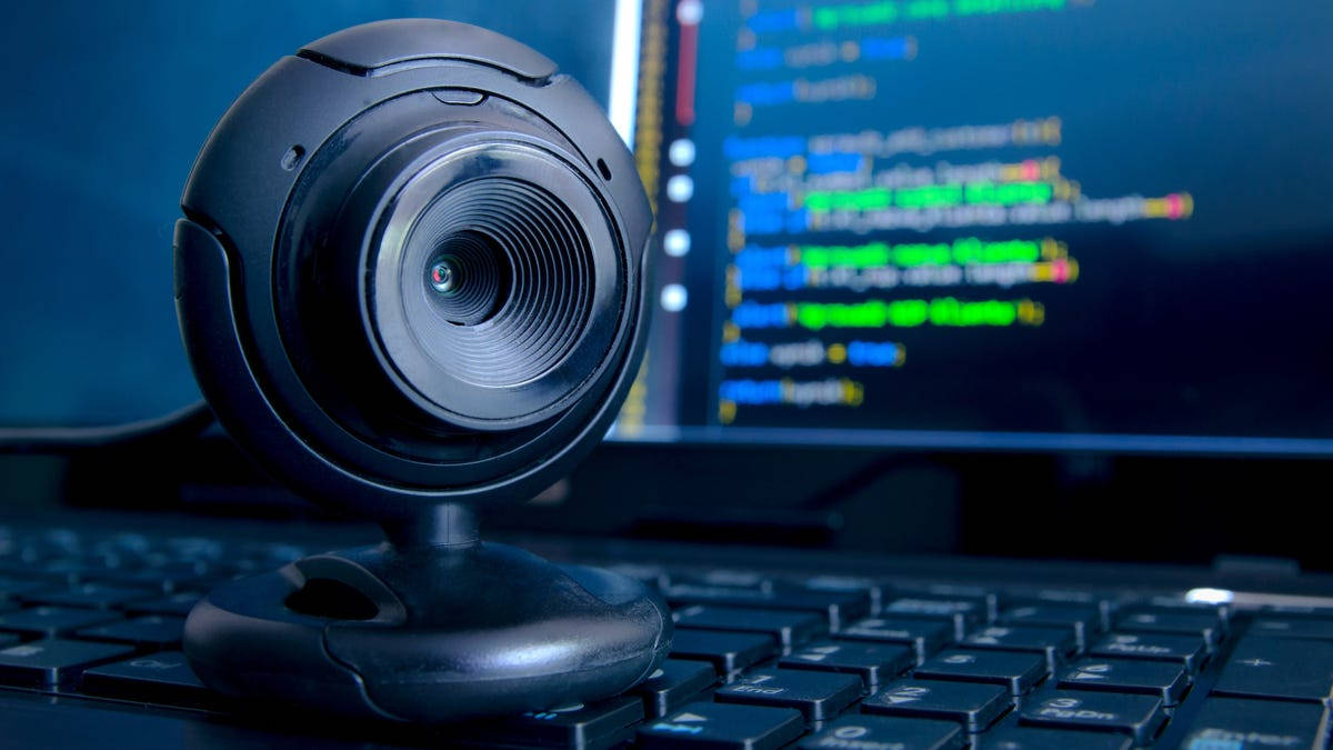 Black Webcam Laptop With Codes Background
