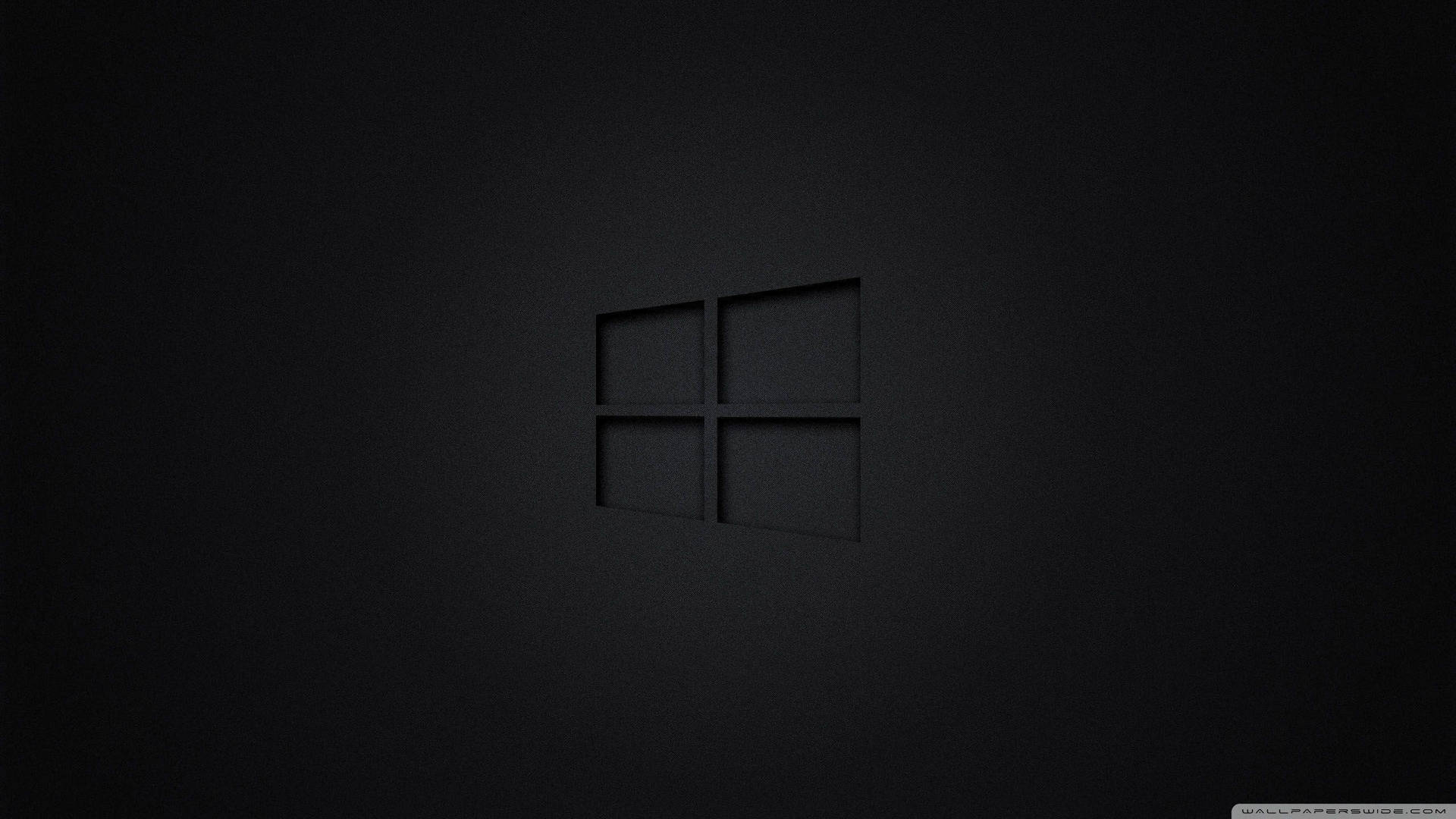 Black Windows Logo On A Dark Screen Background