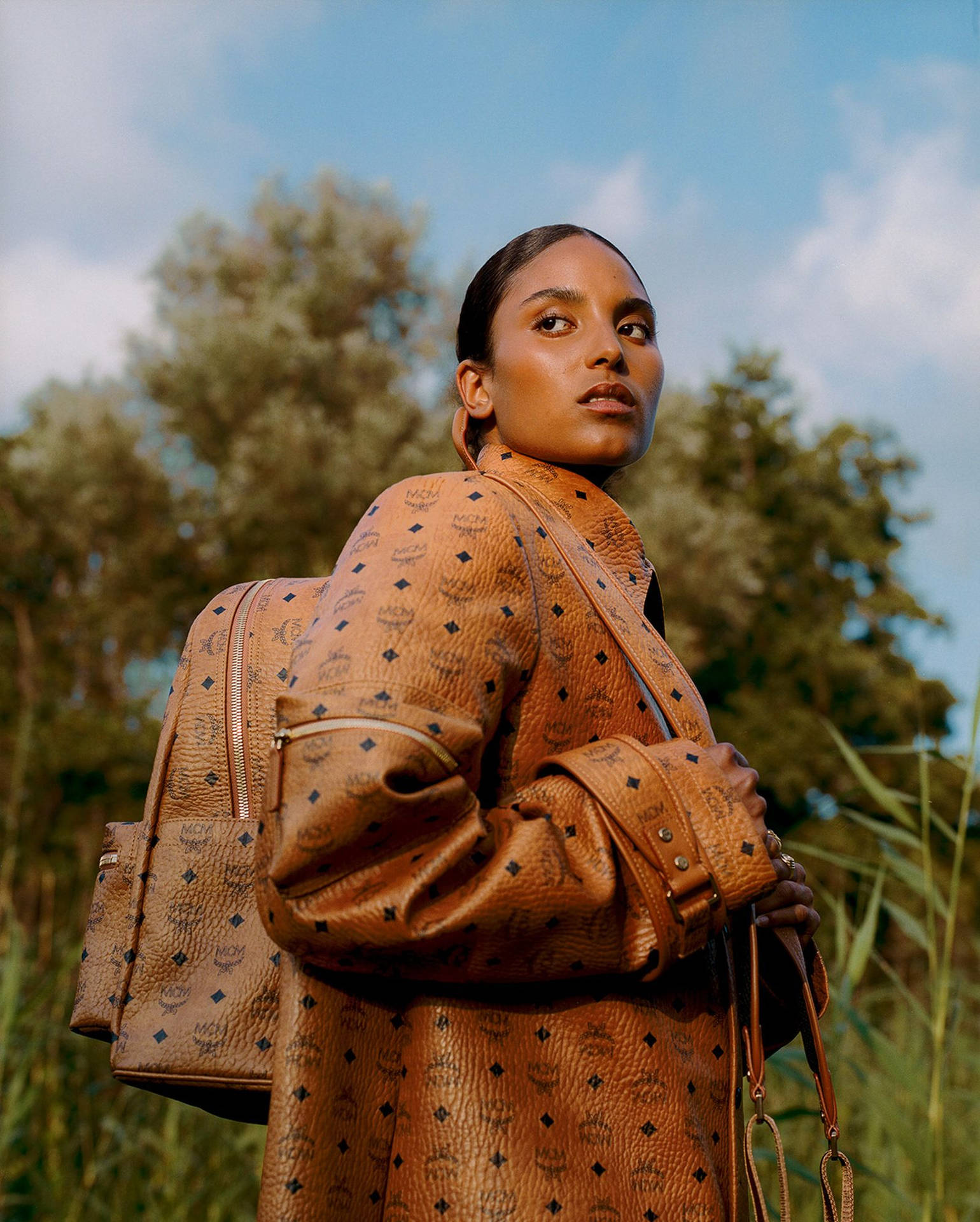 Black Woman Dressed In Mcm Background