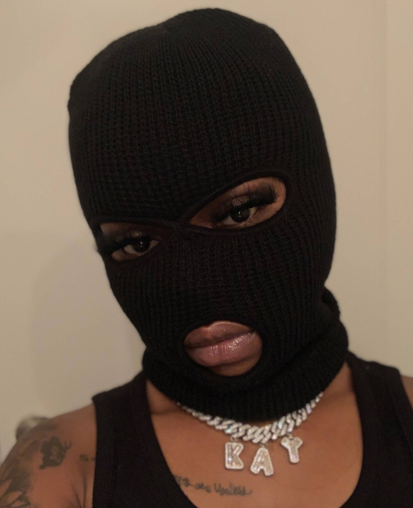 Black Woman Wearing Black Ski Mask Background