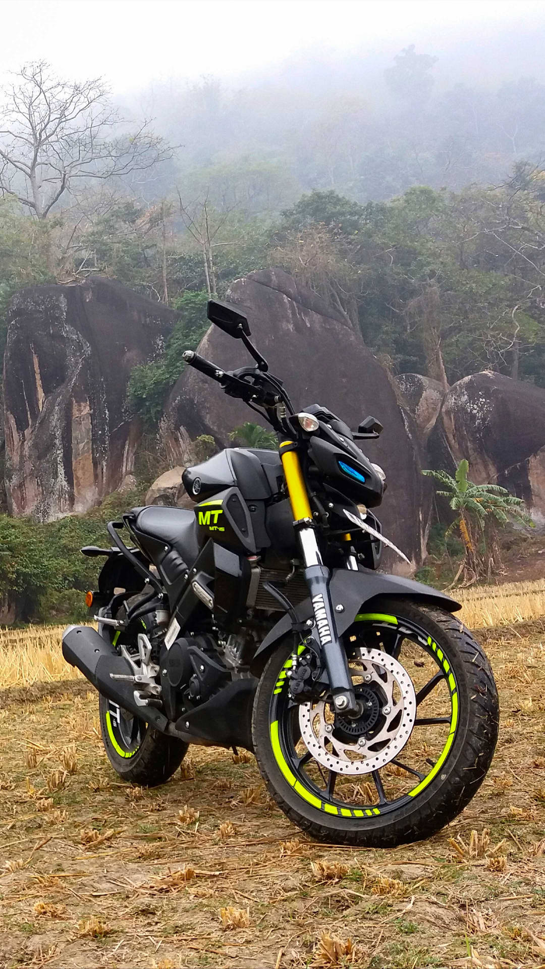 Black Yamaha Mt 15 With Yellow Rims Background