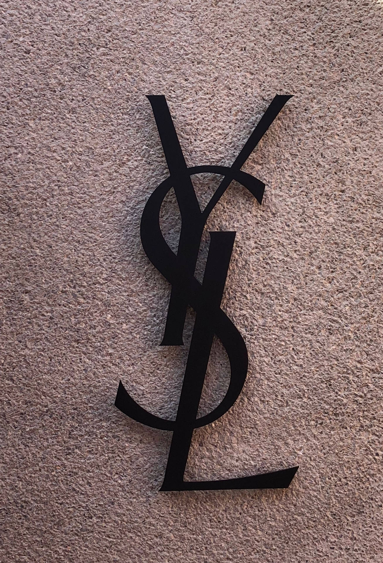 Black Ysl Logo At Wall Background