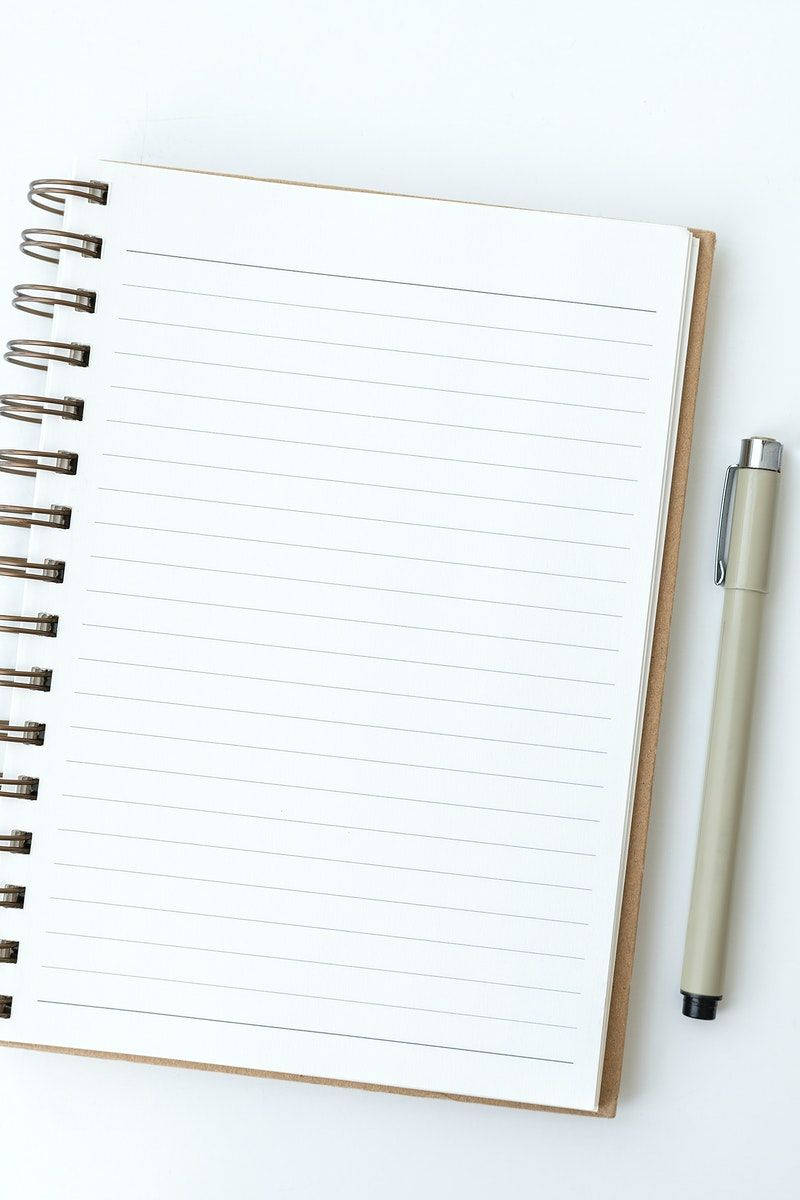 Blank Notebook Page With A Ballpen Background