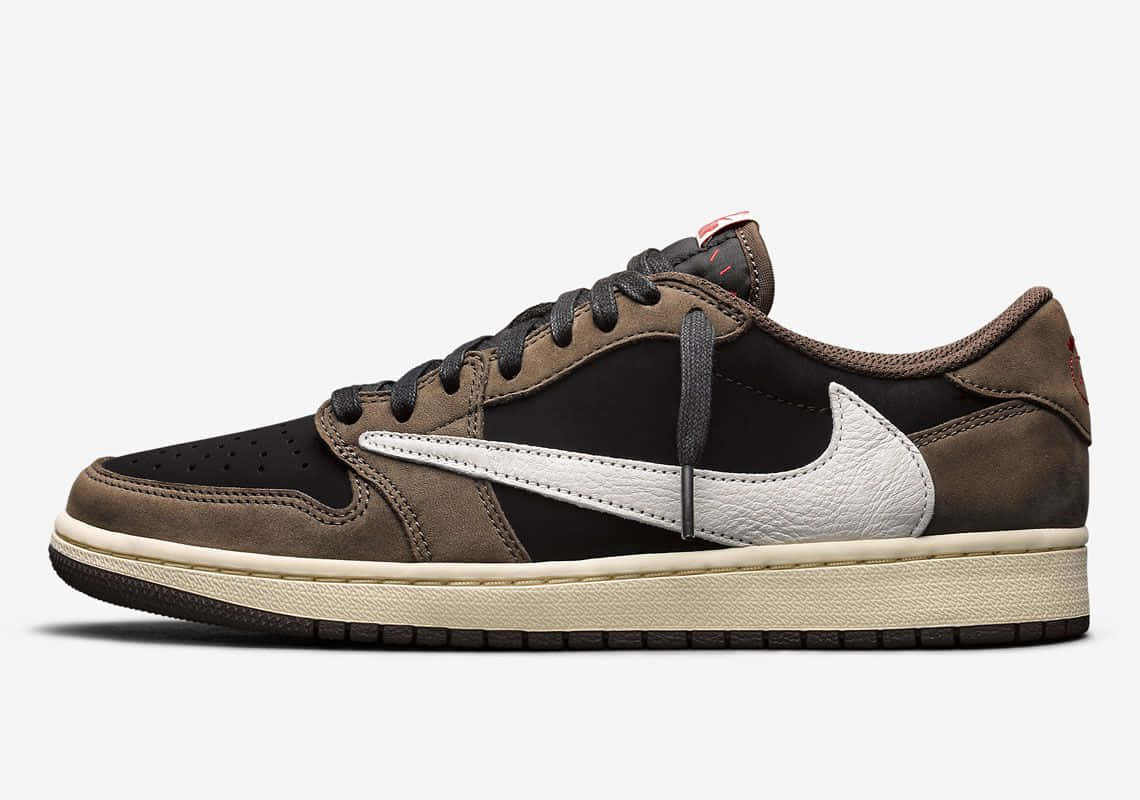Blending Style And Comfort With The Travis Scott Jordan 1 Sneaker. Background