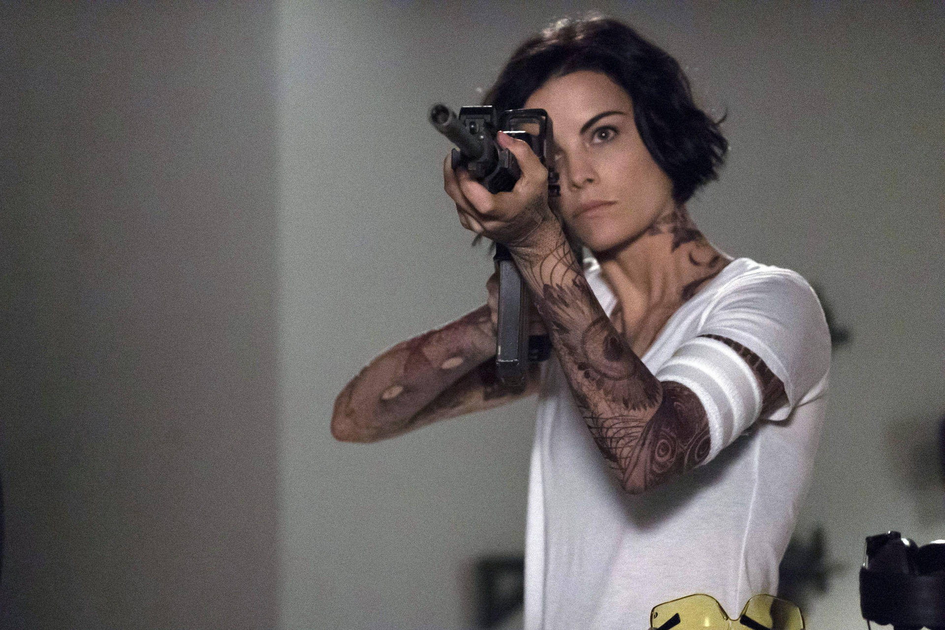 Blindspot Character Jane Doe Aiming A Rifle Background