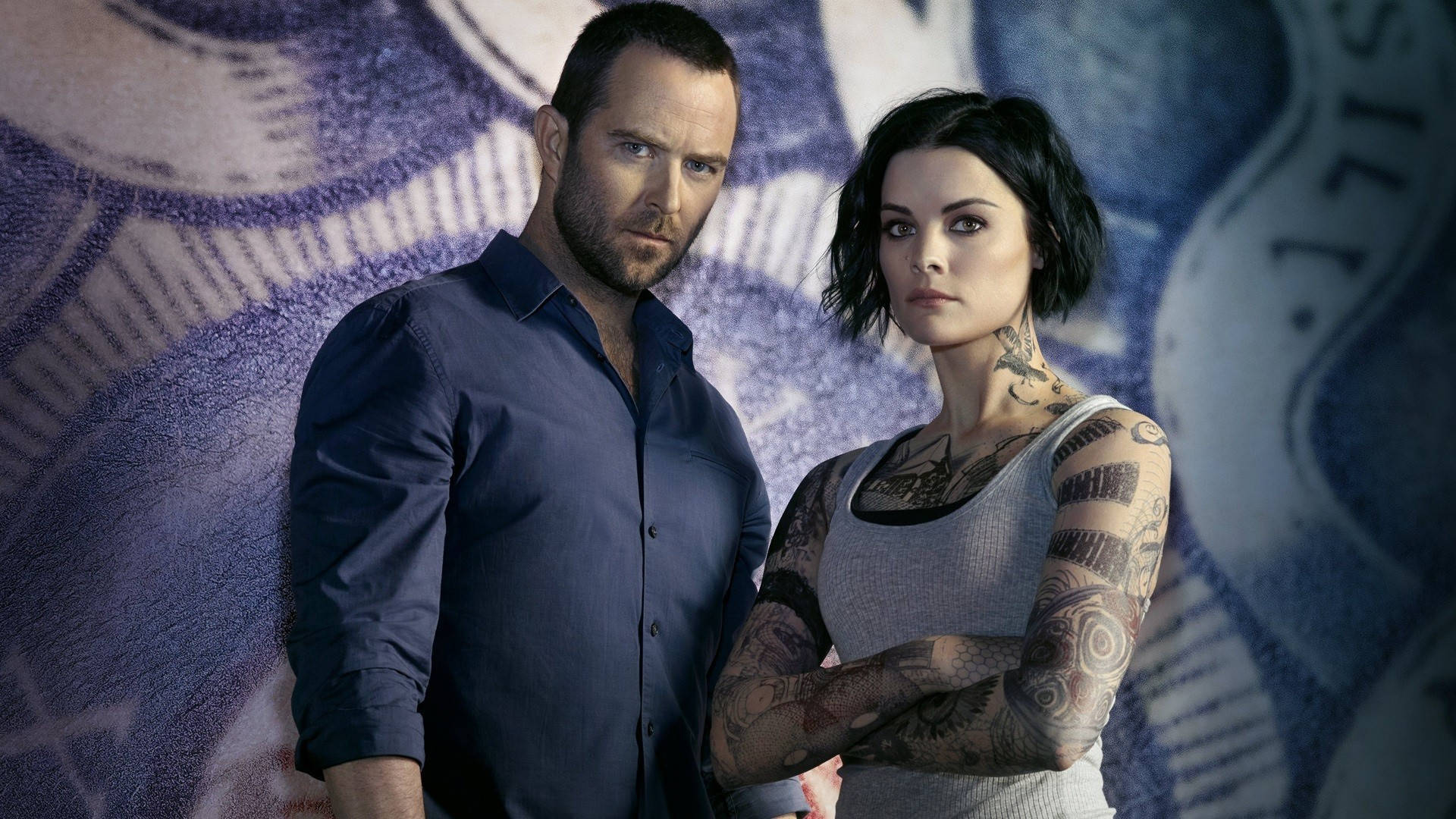 Blindspot Stars Jamie Alexander And Sullivan Stapleton Poster Background