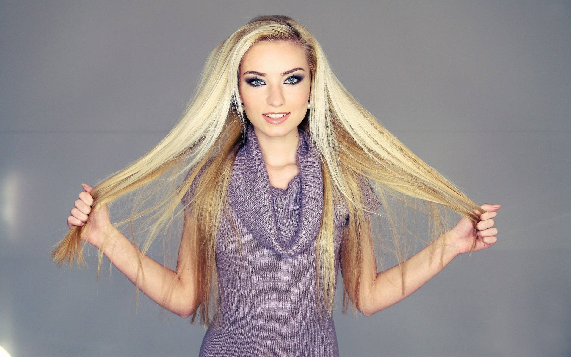 Blonde Girl Holding Hair