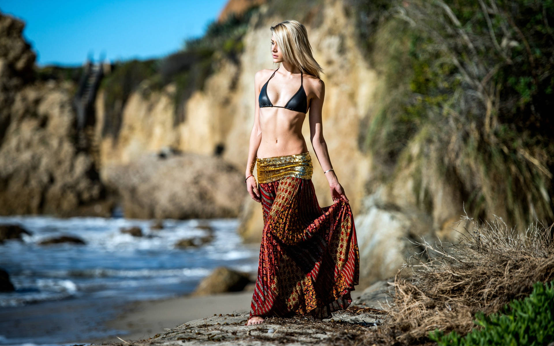 Blonde-haired Girl In Bikini On An Island Background