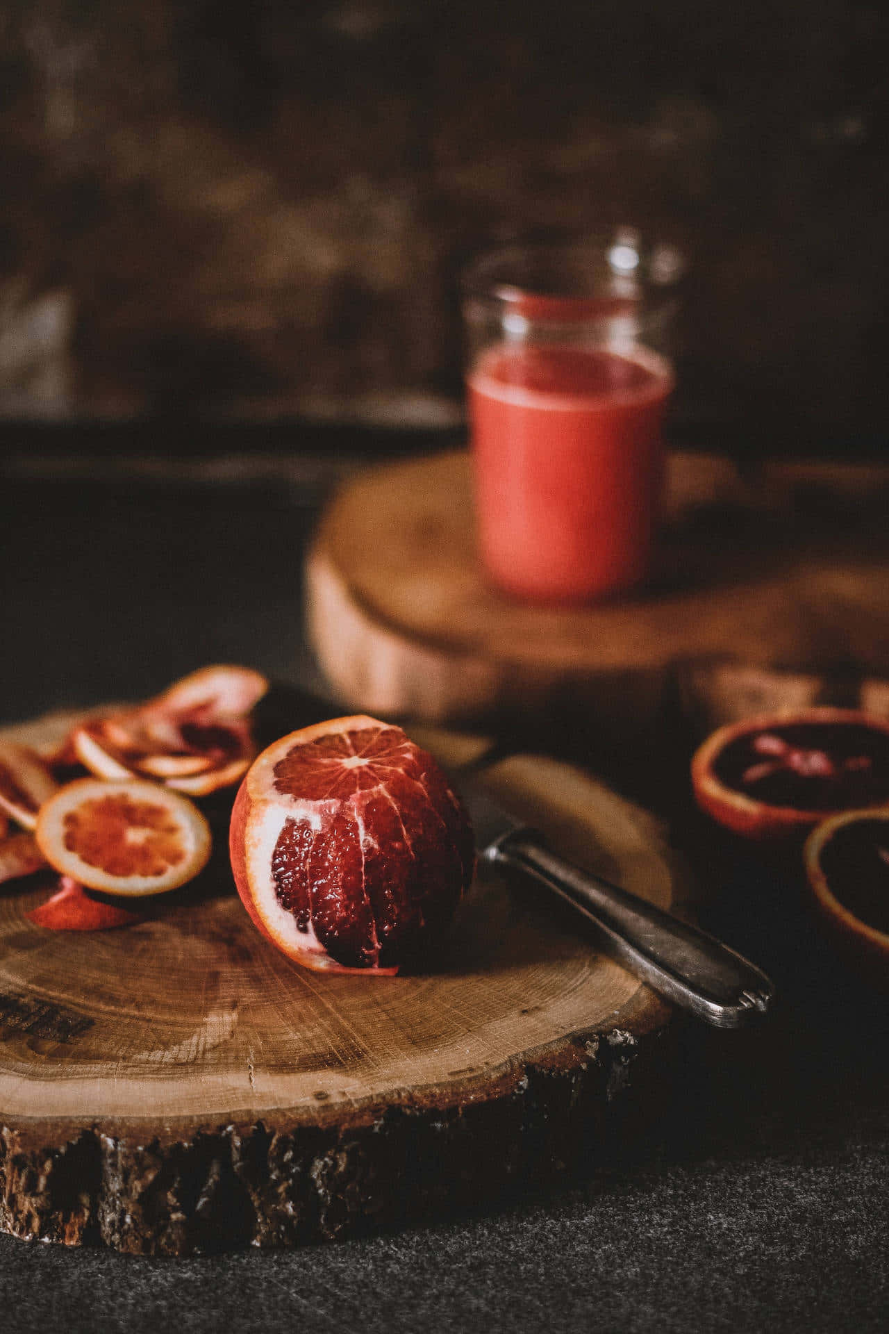 Blood Orange Juice On A Wooden Cutting Board Background