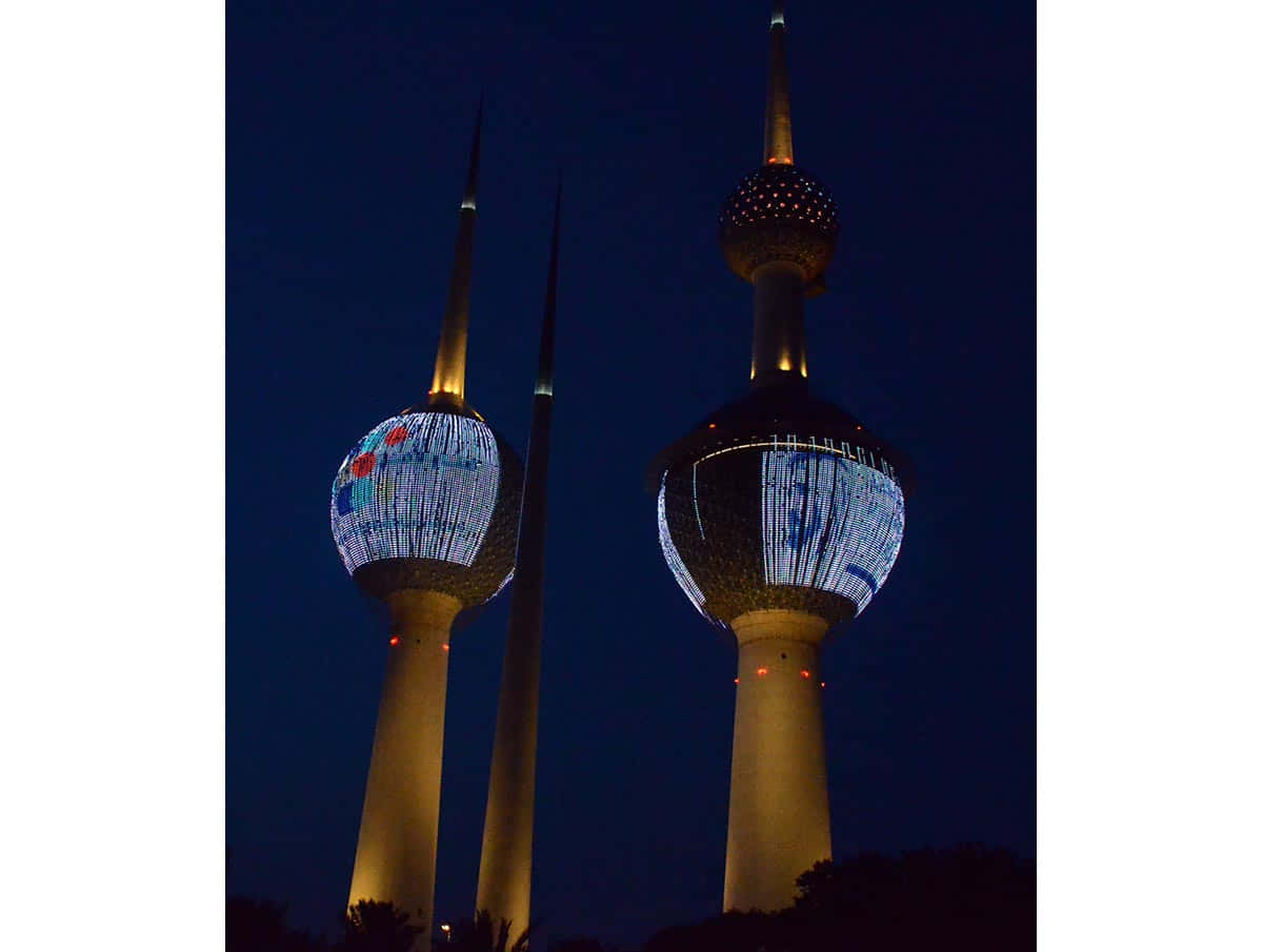 Blue And Gold Kuwait Towers Night Background