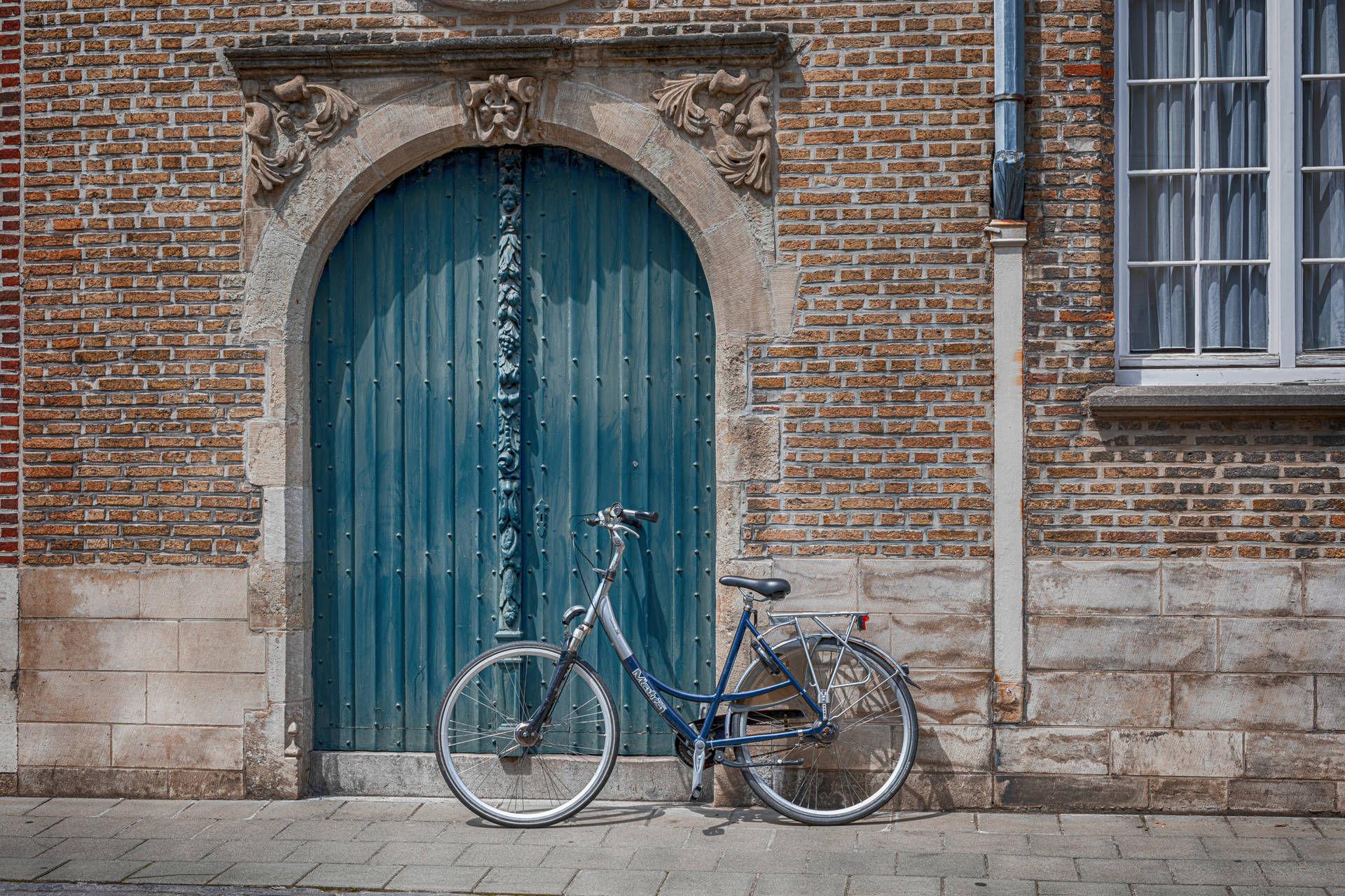 Blue Arched Door With Japanese Bike Background