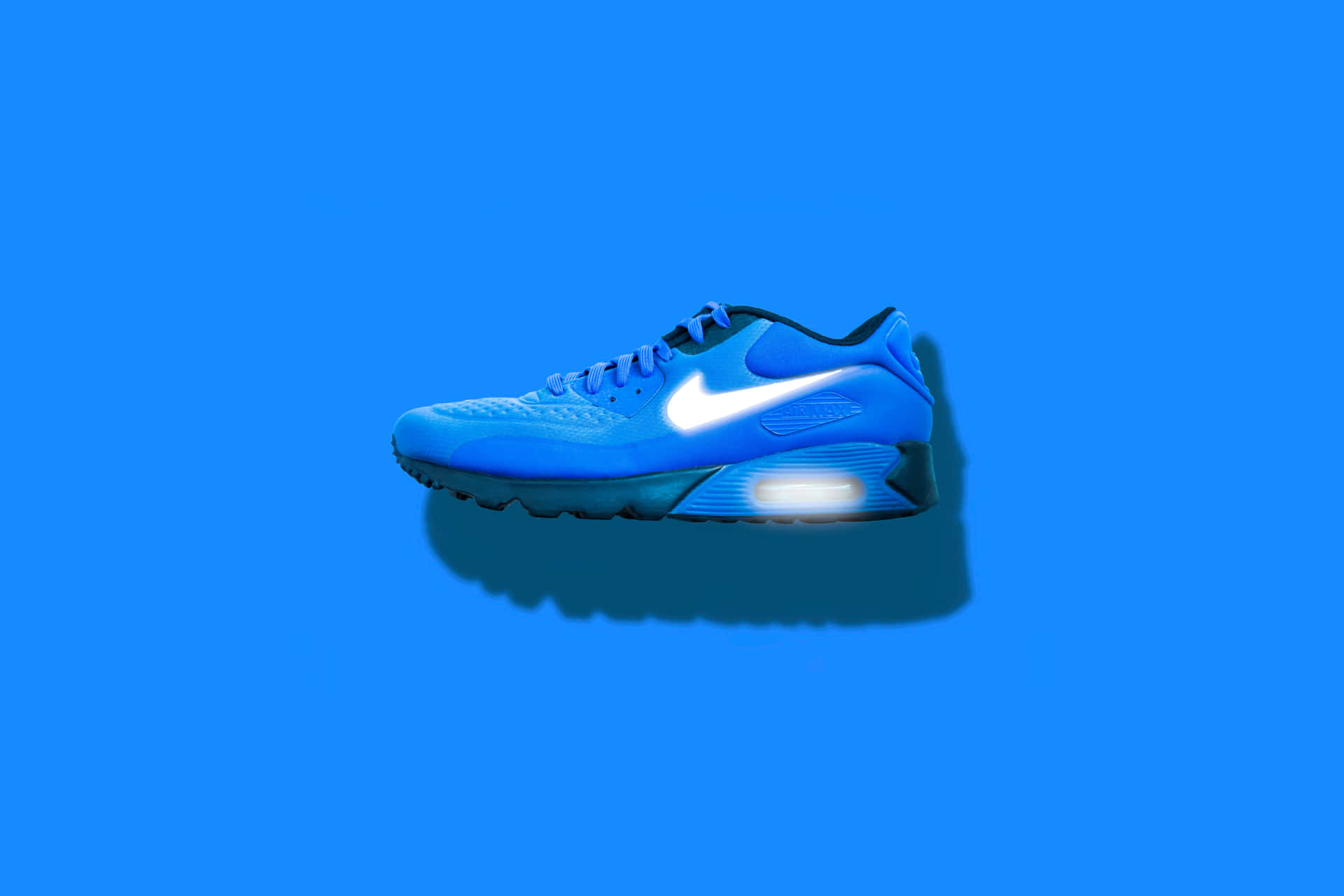 Blue Athletic Sneakeron Blue Background.jpg Background