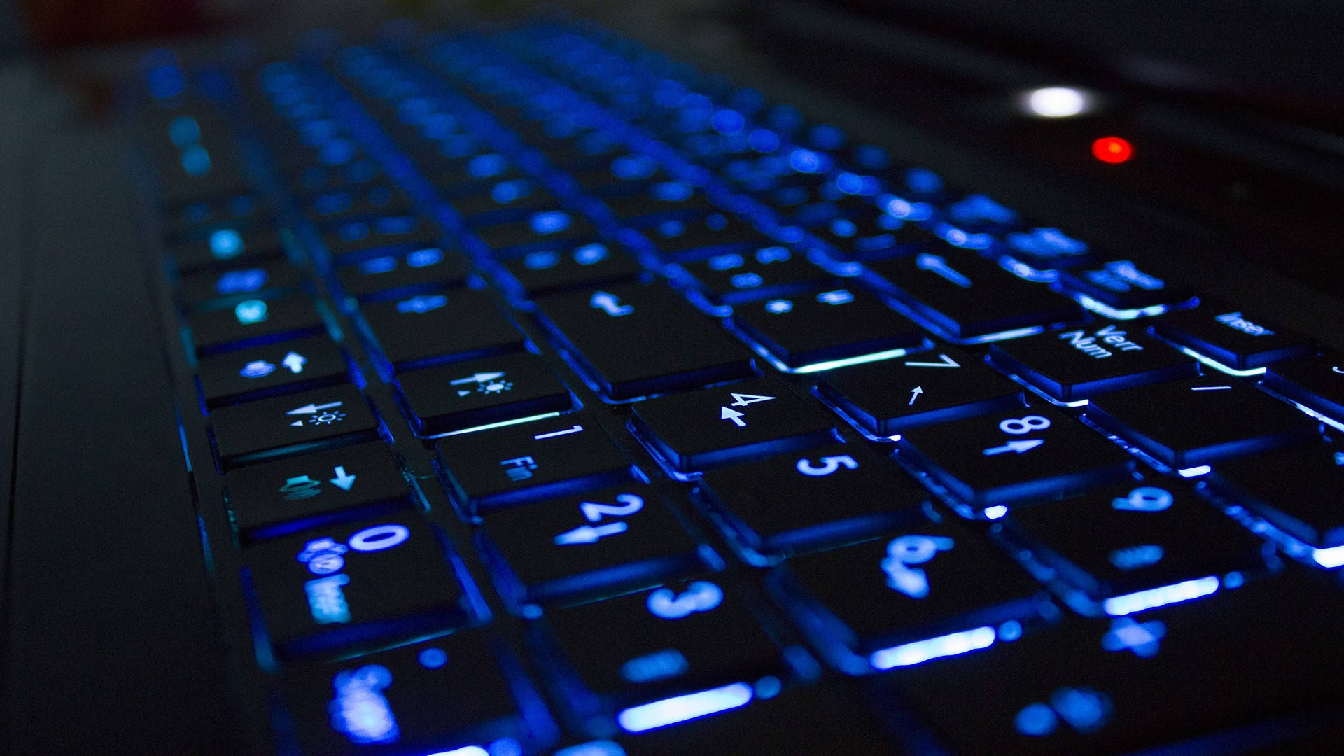 Blue Back Lit Computer Keyboard Background