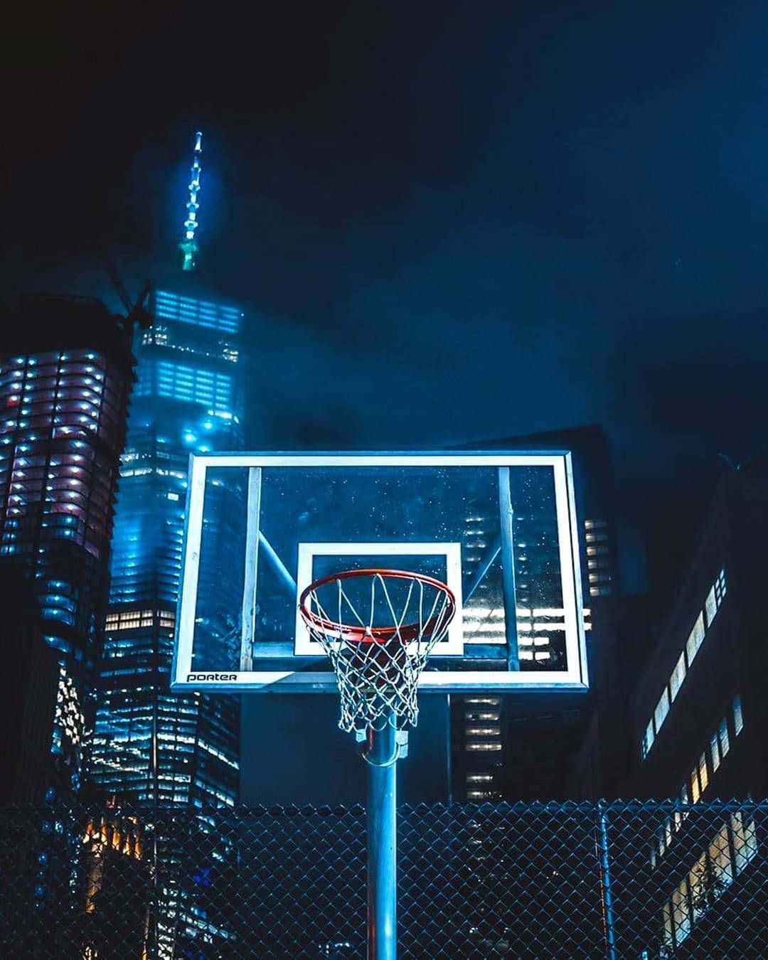 Blue Basketball Ring And Skyscrapers Background
