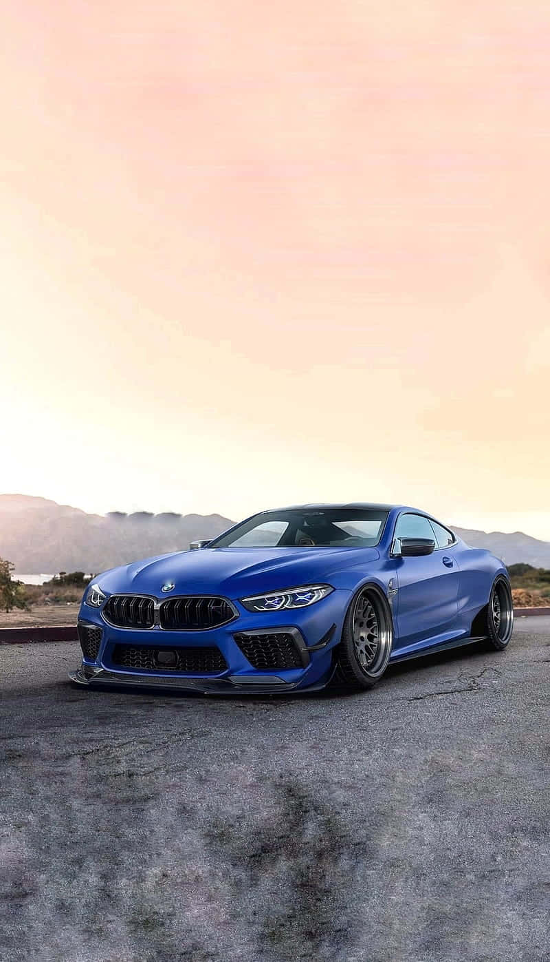 Blue Bmw M8 4k Mobile By The Sunrise Background