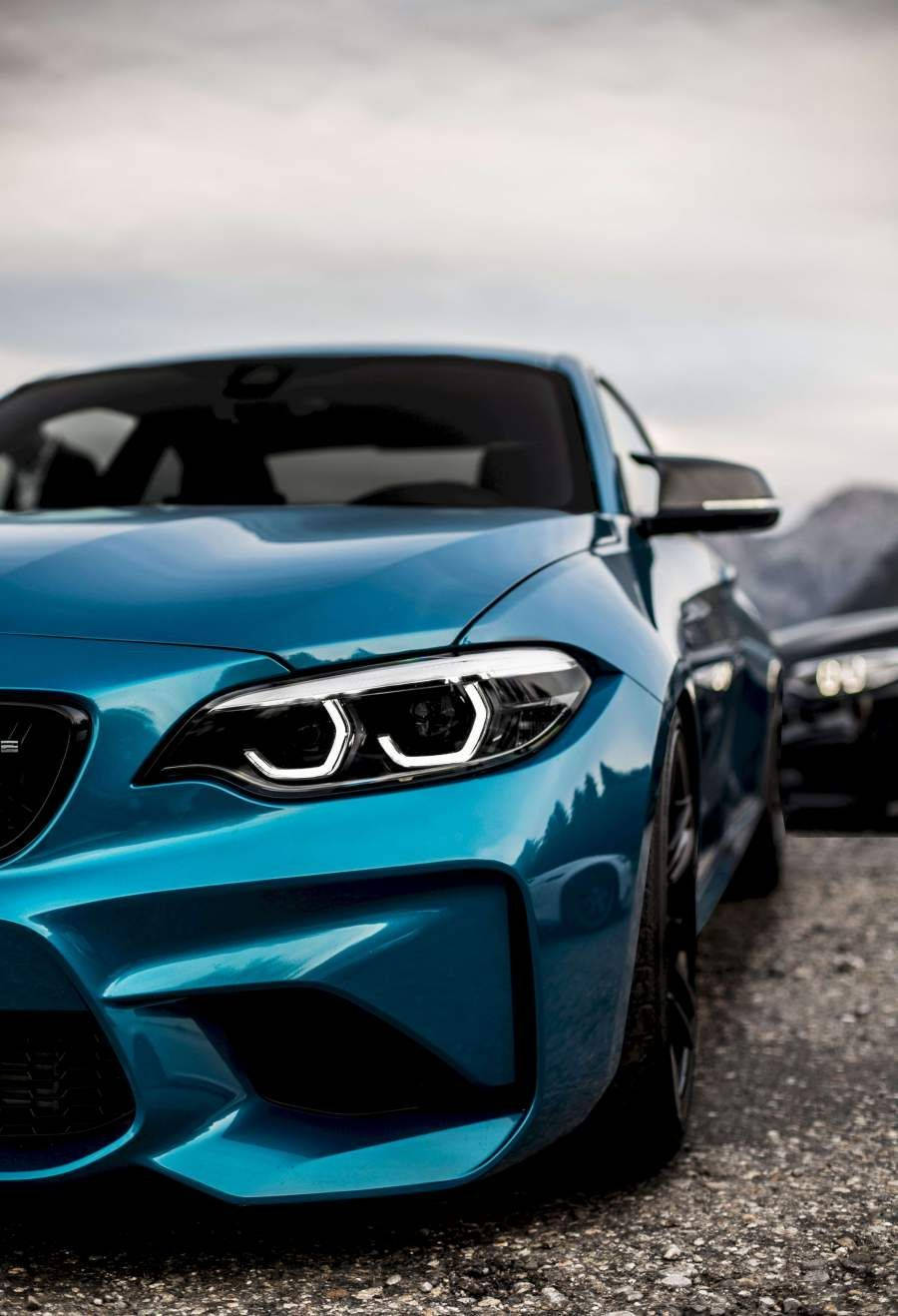 Blue Bmw Parked On Gravels