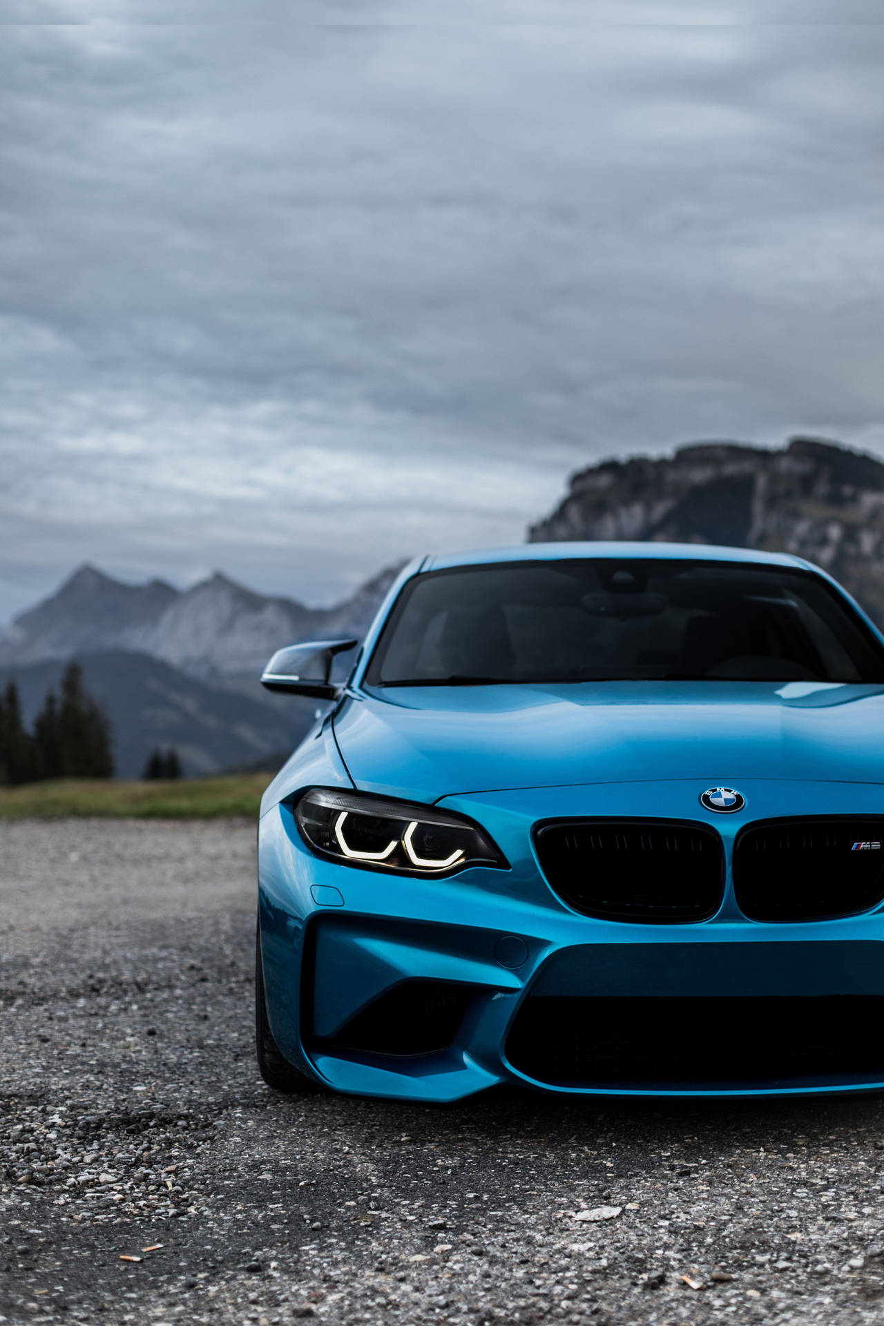 Blue Bmw Parked Outdoors Background