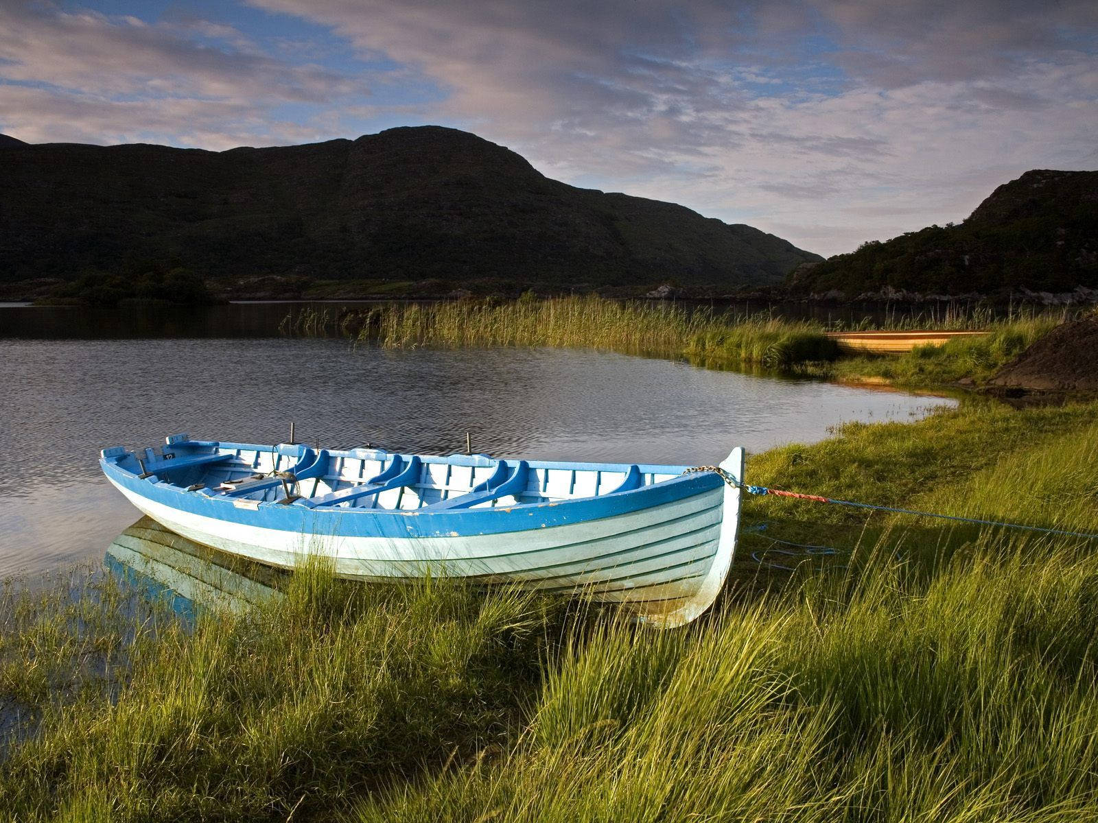 Blue Boat On Ireland River Background