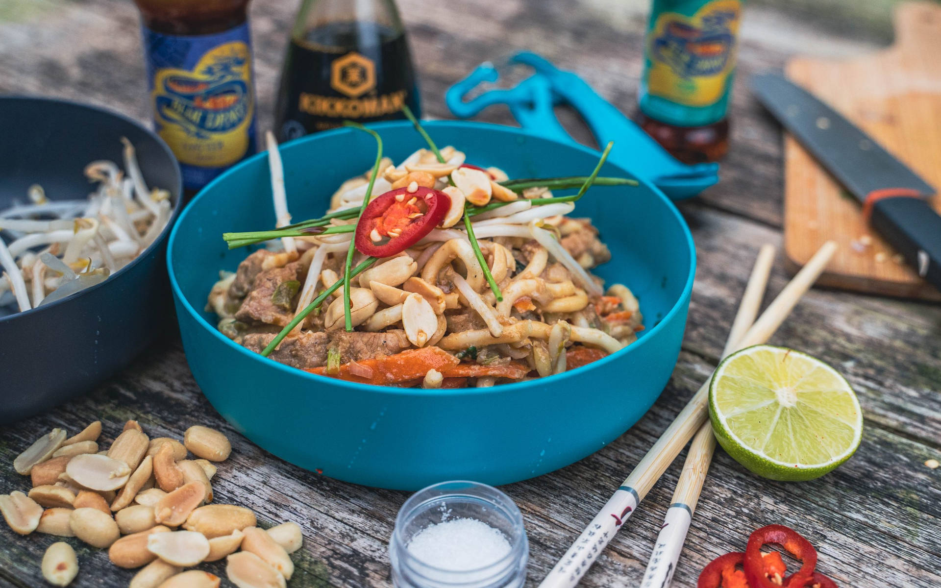 Blue Bowl Of Pad Thai Noodles And Nuts Background