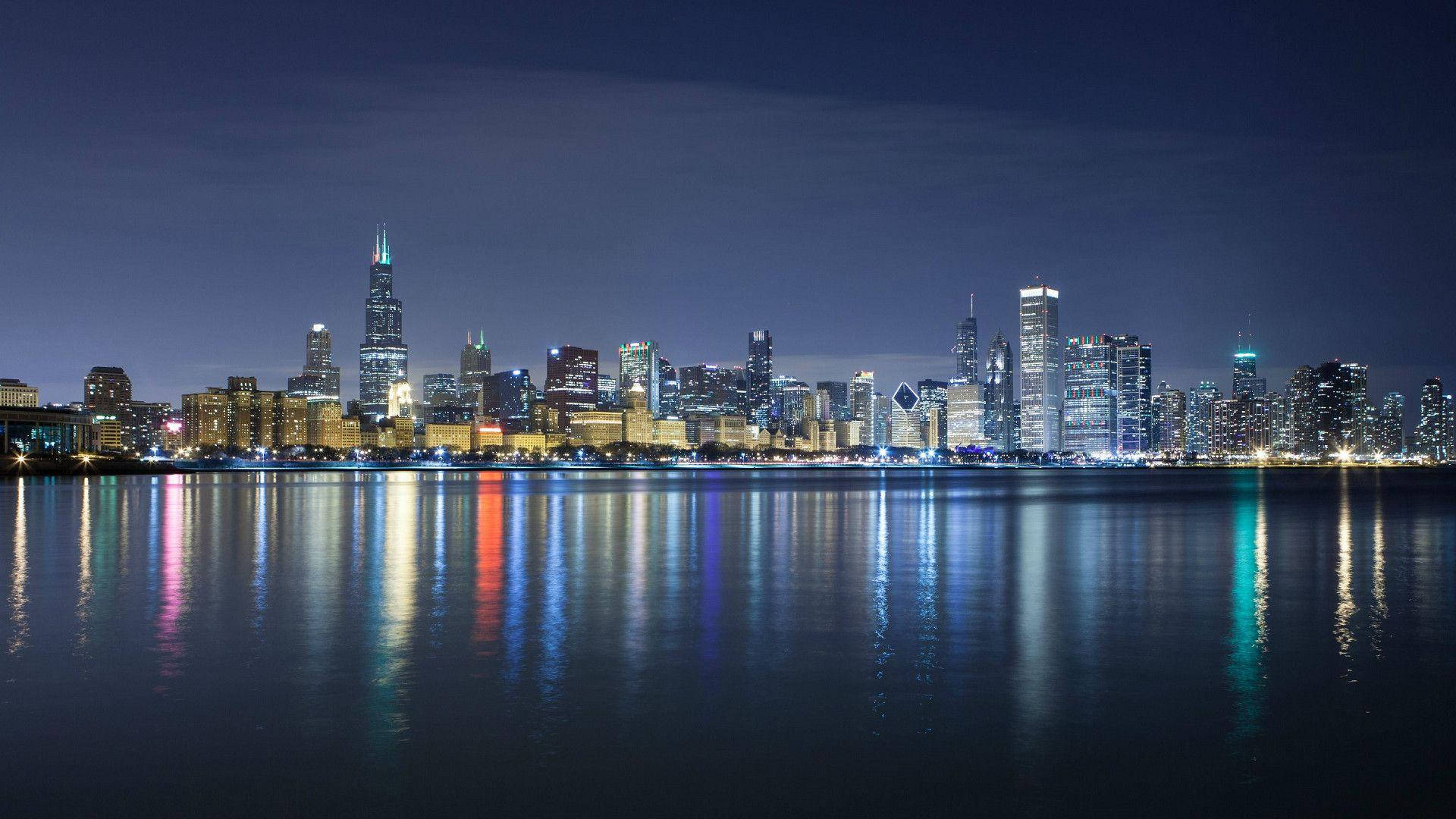 Blue Chicago Skyline In The Evening Background