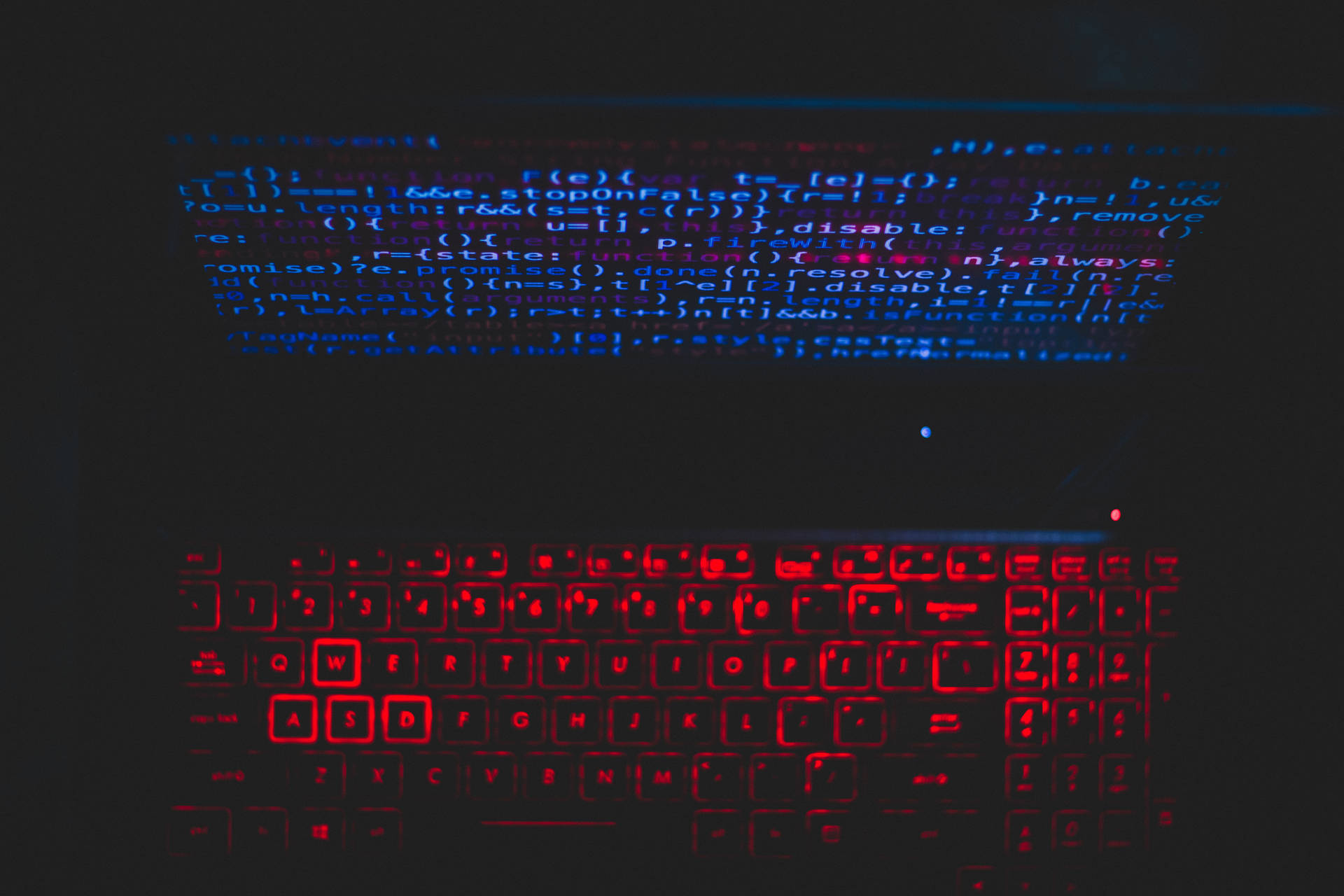 Blue Computer Screen And Red Keyboard