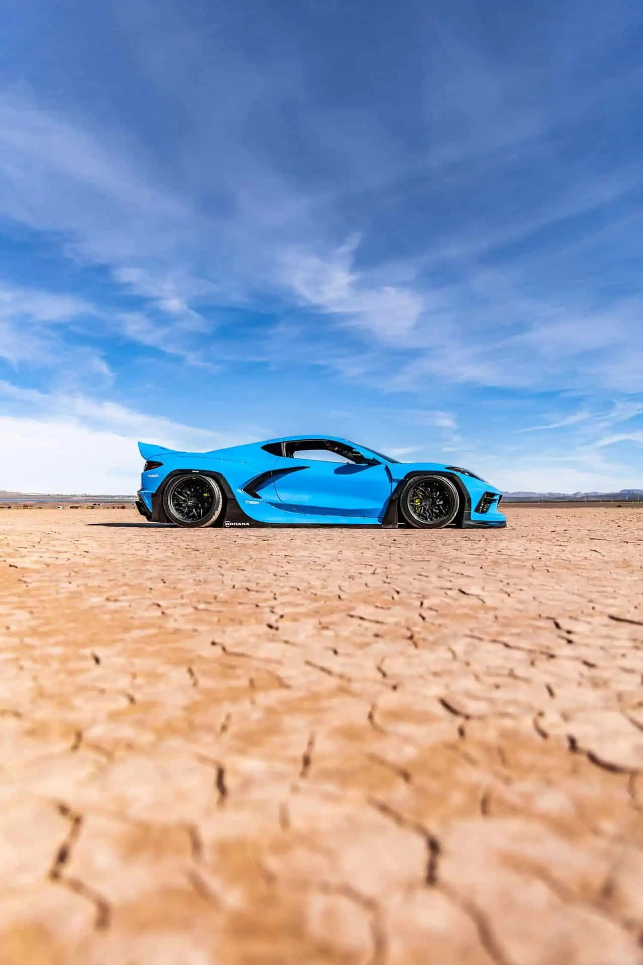 Blue Corvette C8 Desert Landscape Background